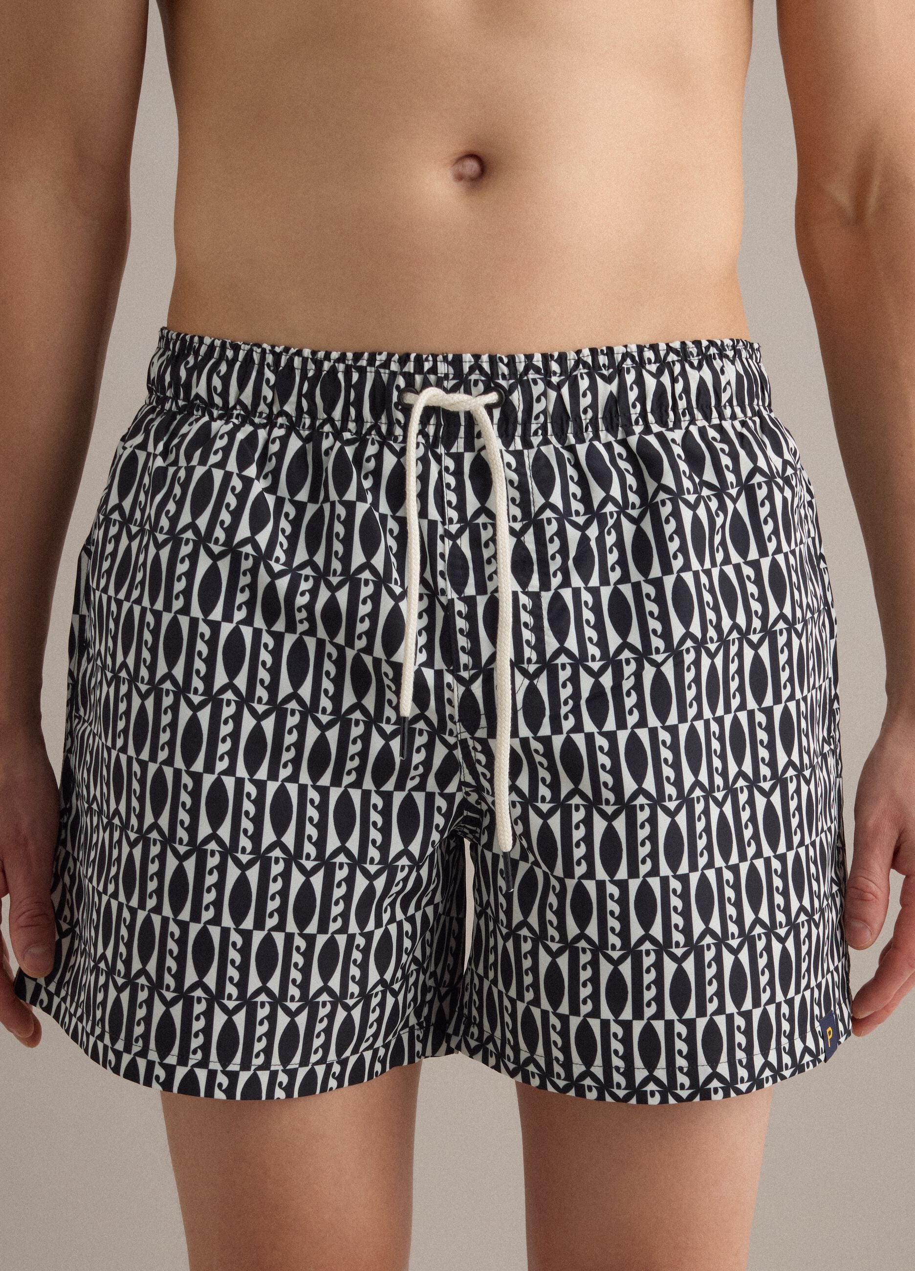 Blue swim shorts with graphic print