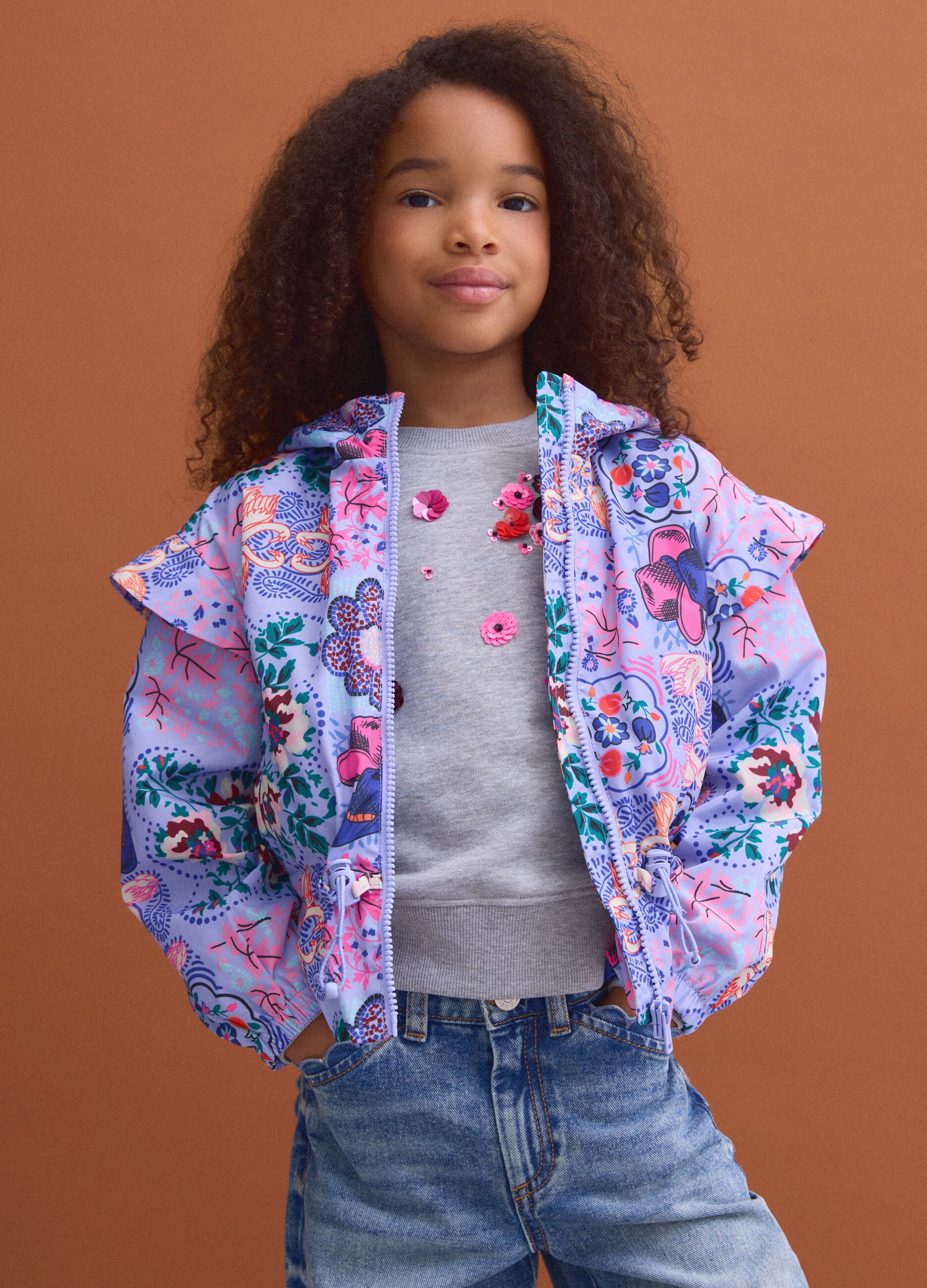 Girls&rsquo; multicolour hooded rain jacket with all-over print
