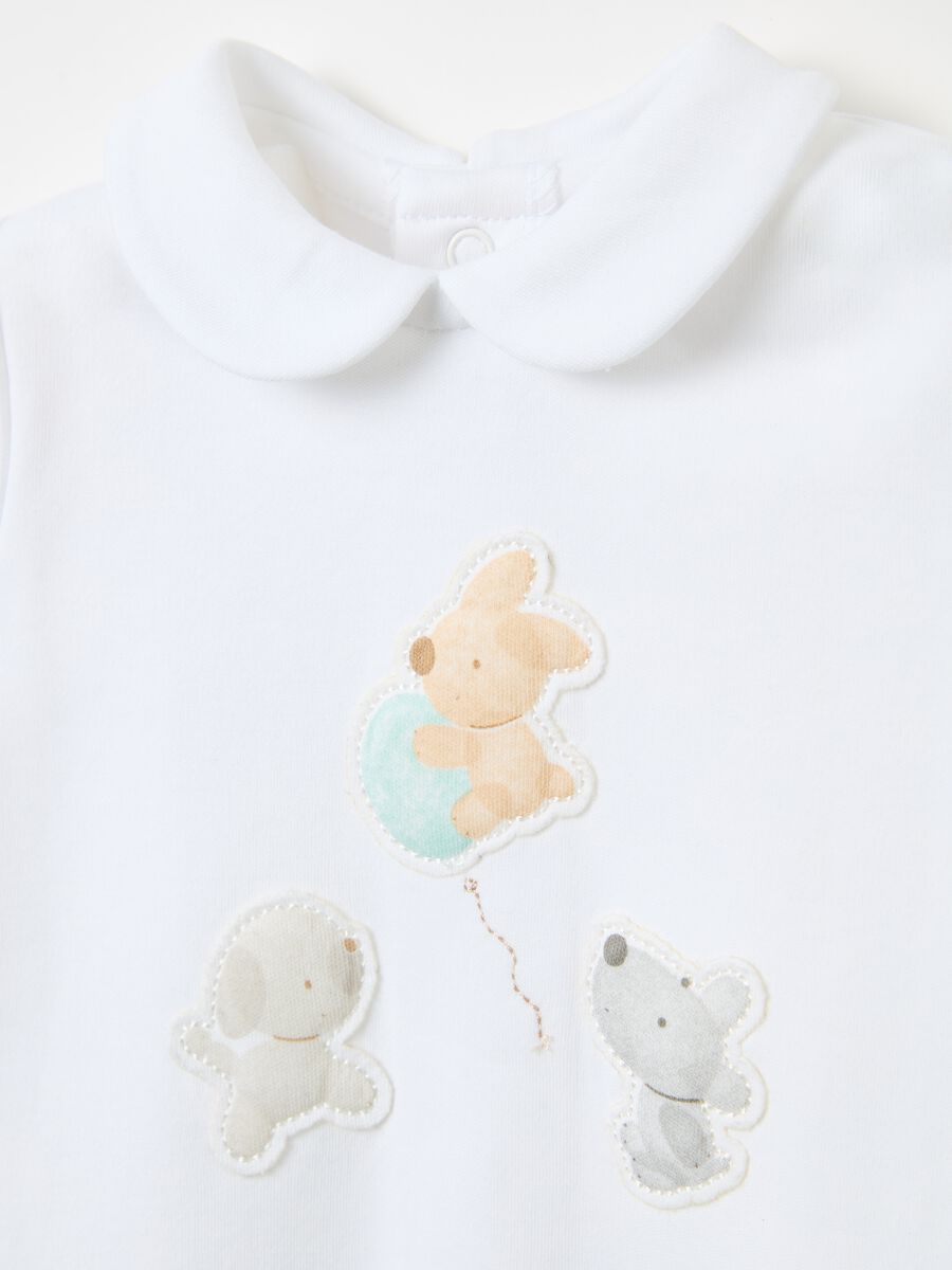 Tutina in cotone bio con piedini e applicazione_2