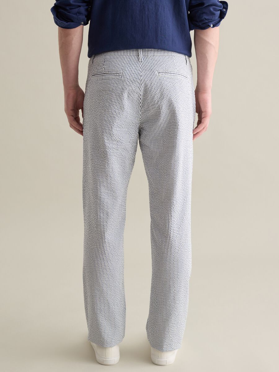 Seersucker chino trousers with white and blue stripes_3