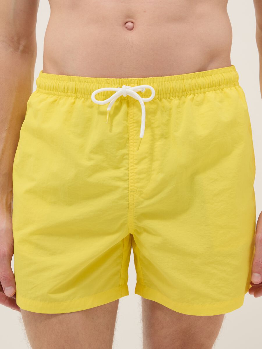Yellow swim shorts with elasticated waistband_1