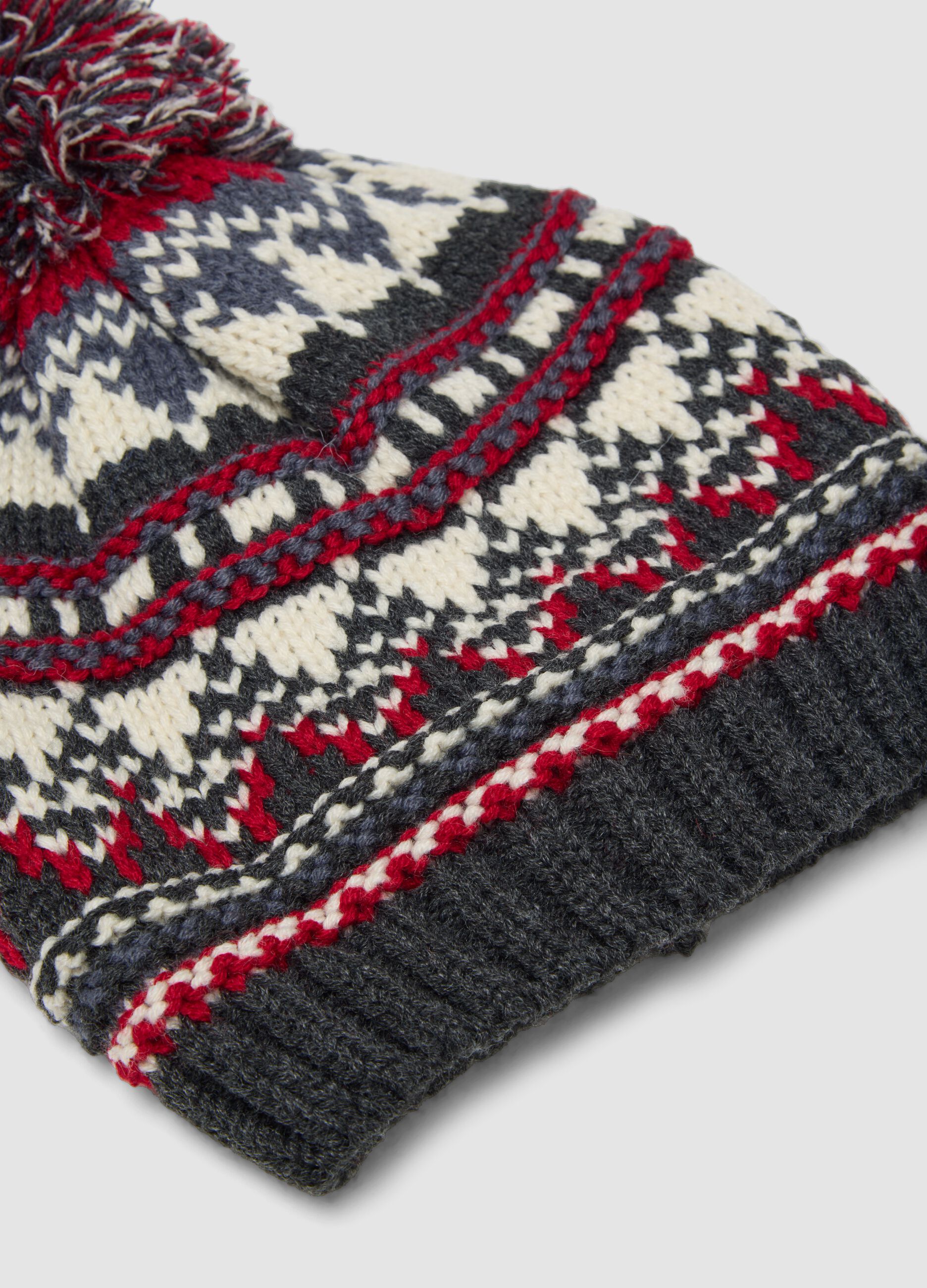 Berretto con fantasia jacquard e pon pon