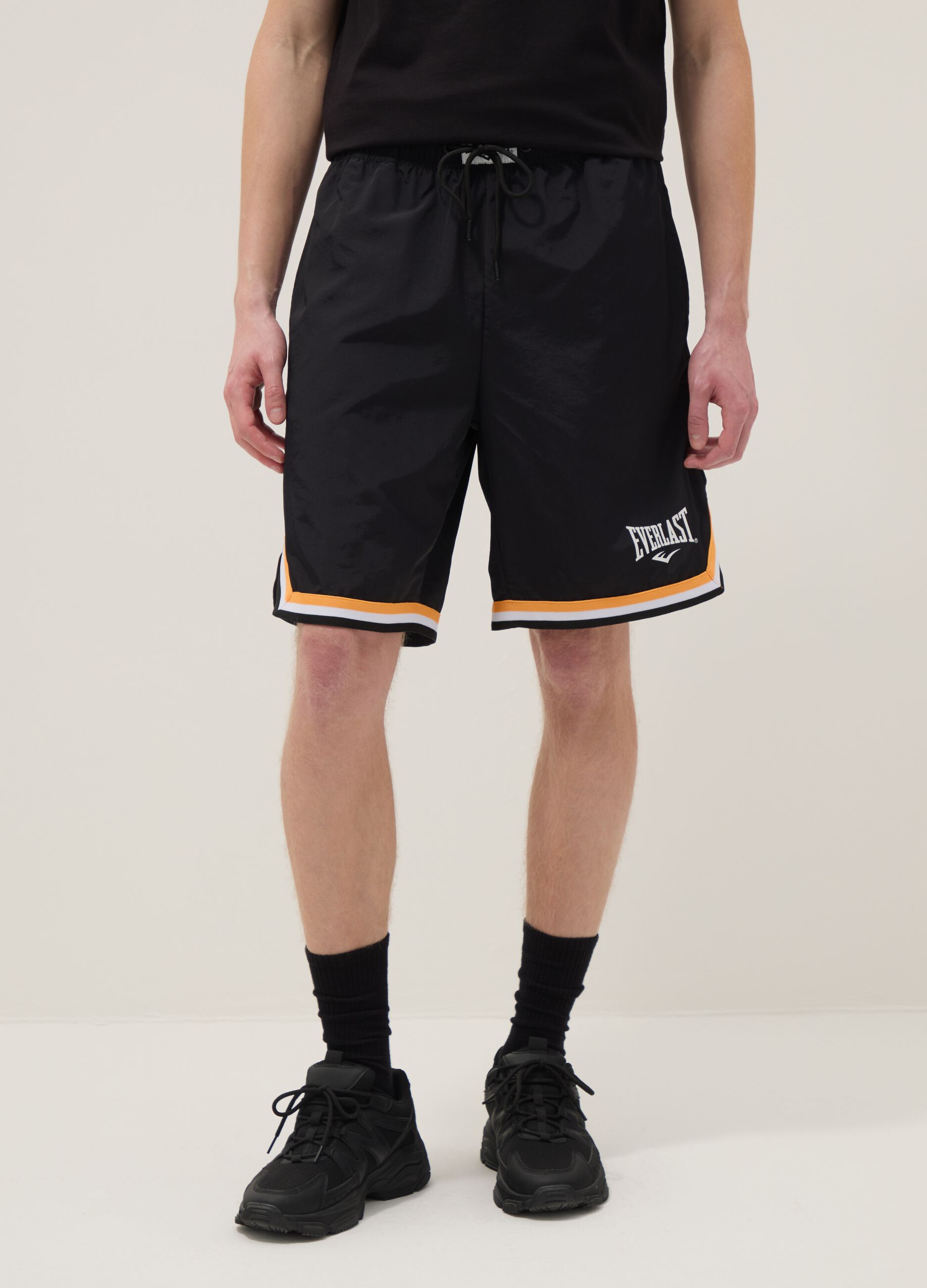 Regular fit black sports shorts with white and orange details