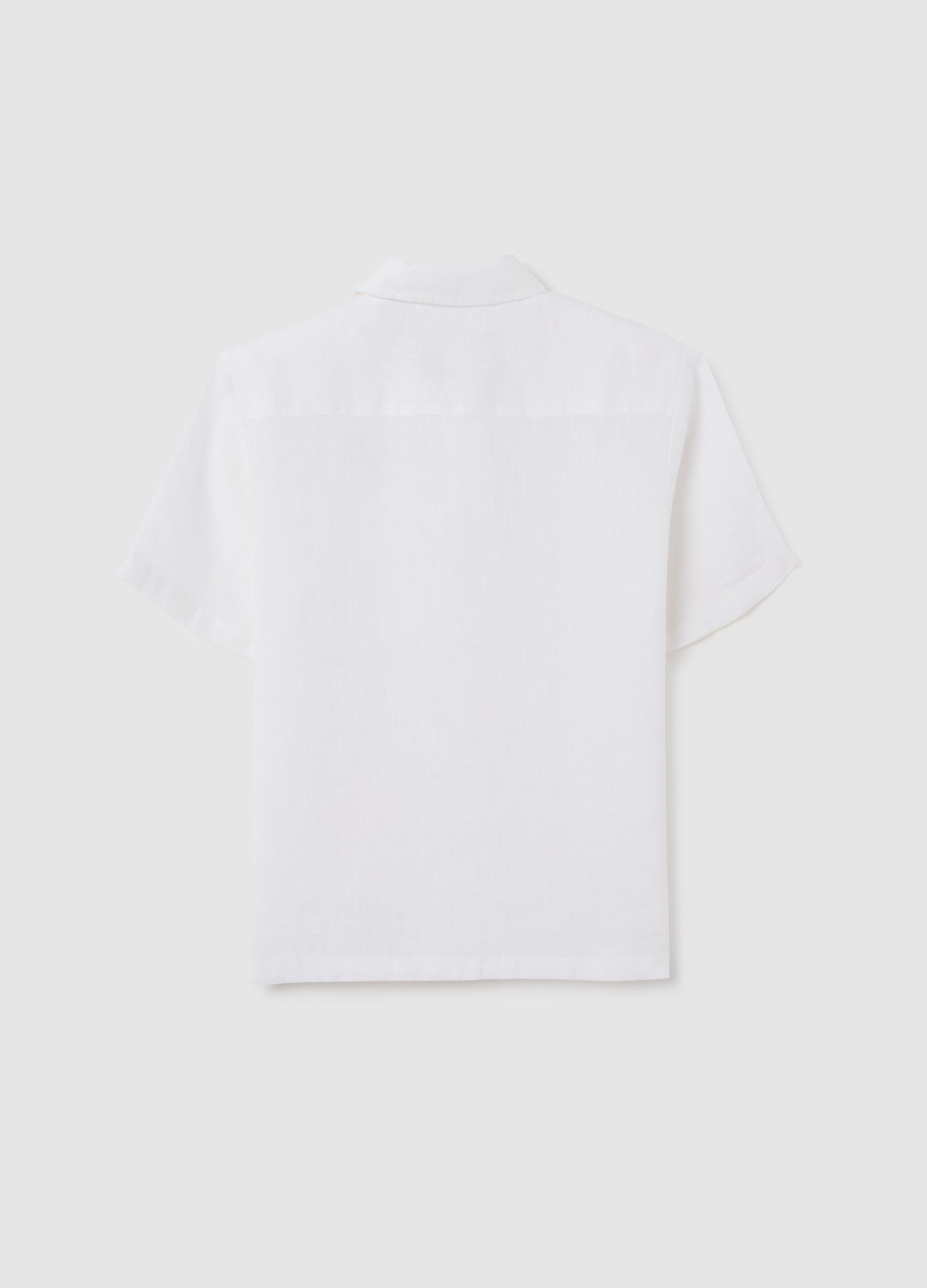 White linen kids' polo with an oversized fit and buttons