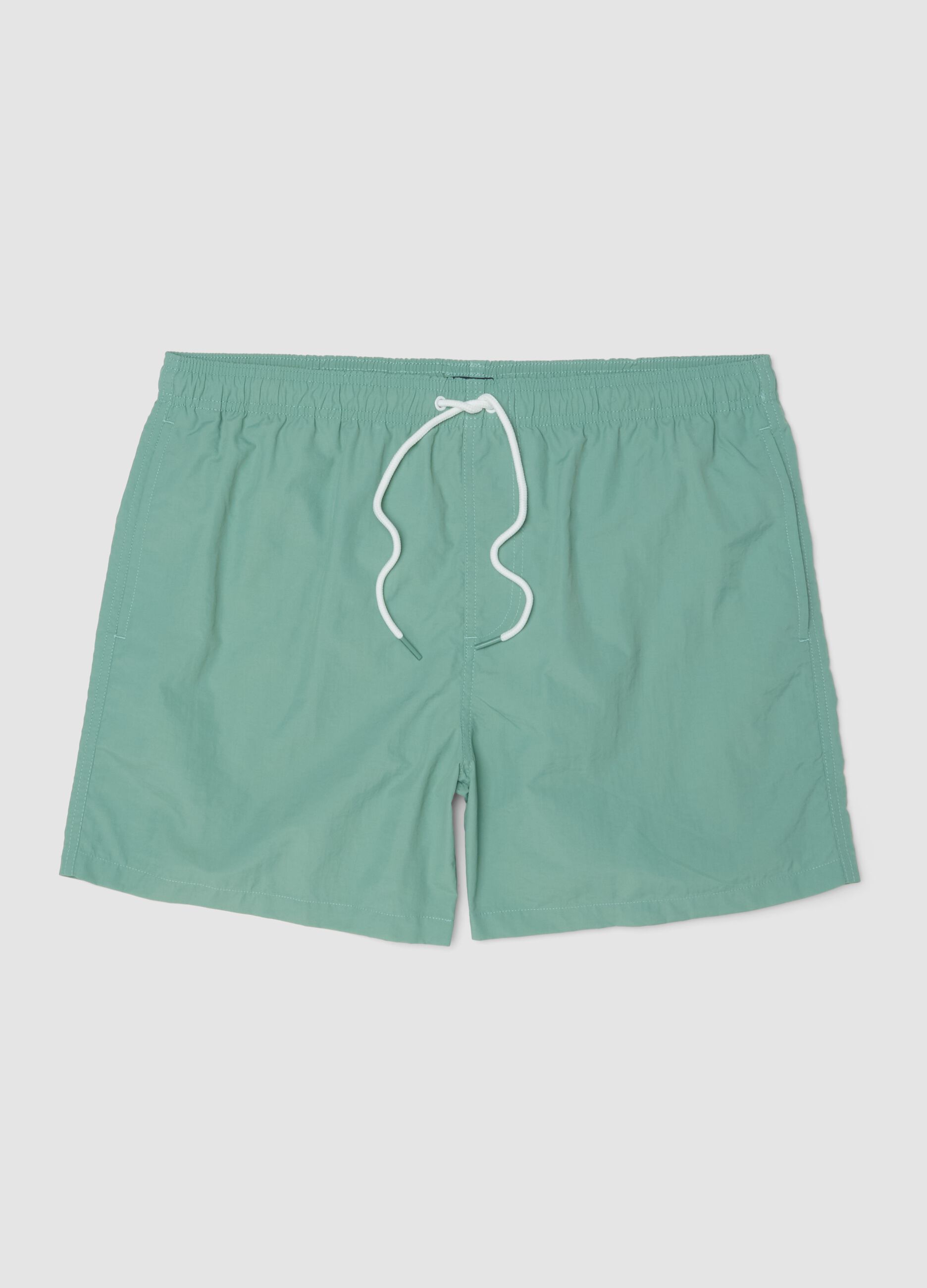 Green swim shorts with elasticated waistband