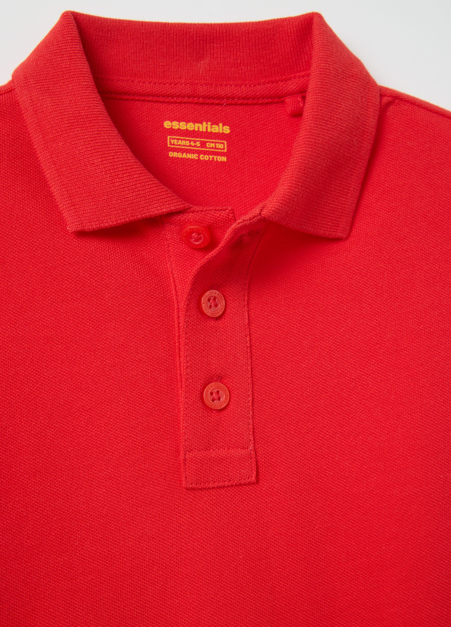 Red polo shirt with short sleeves in organic cotton