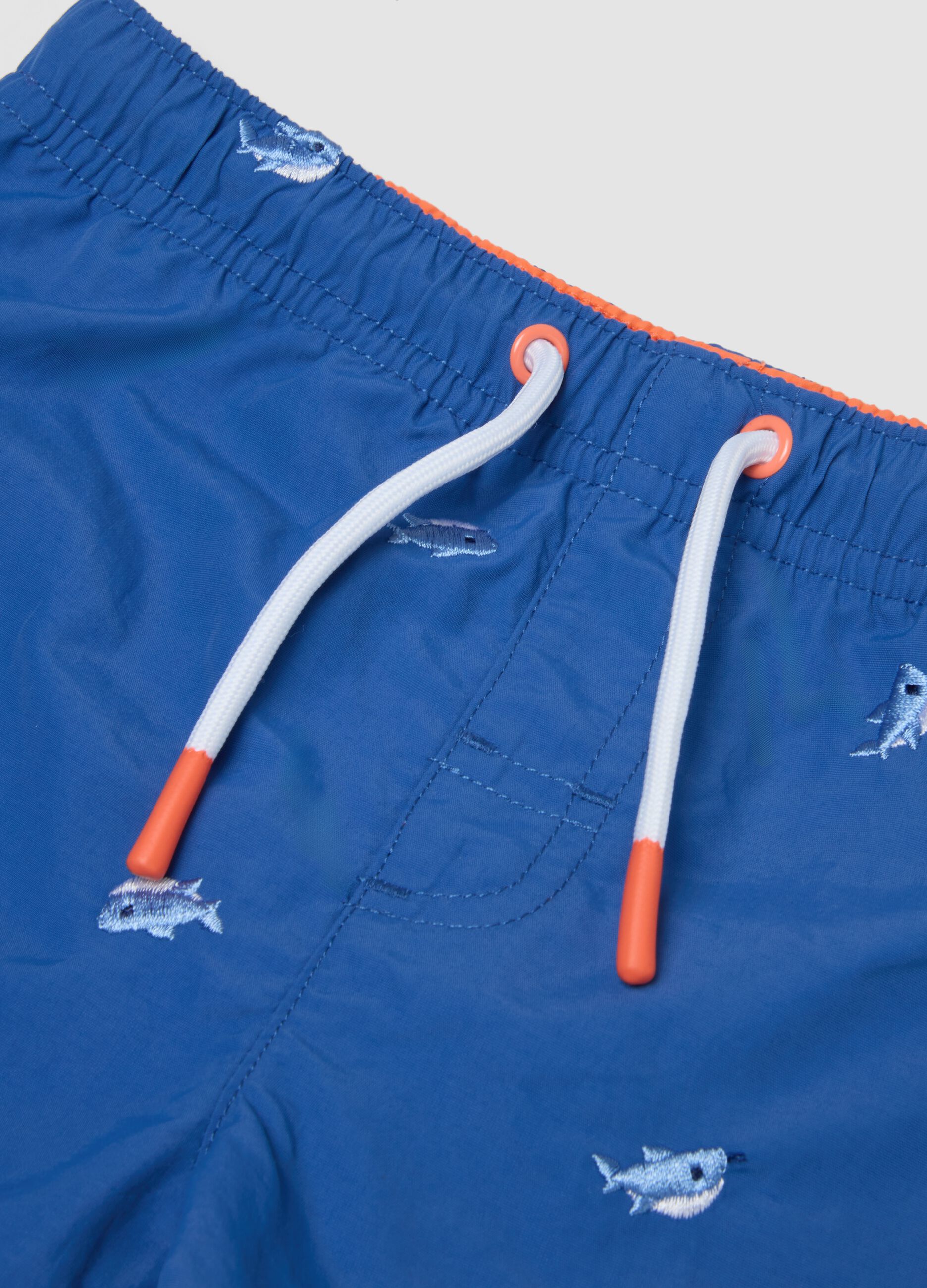 Sea-blue boys&rsquo; boxer swim shorts with fish print