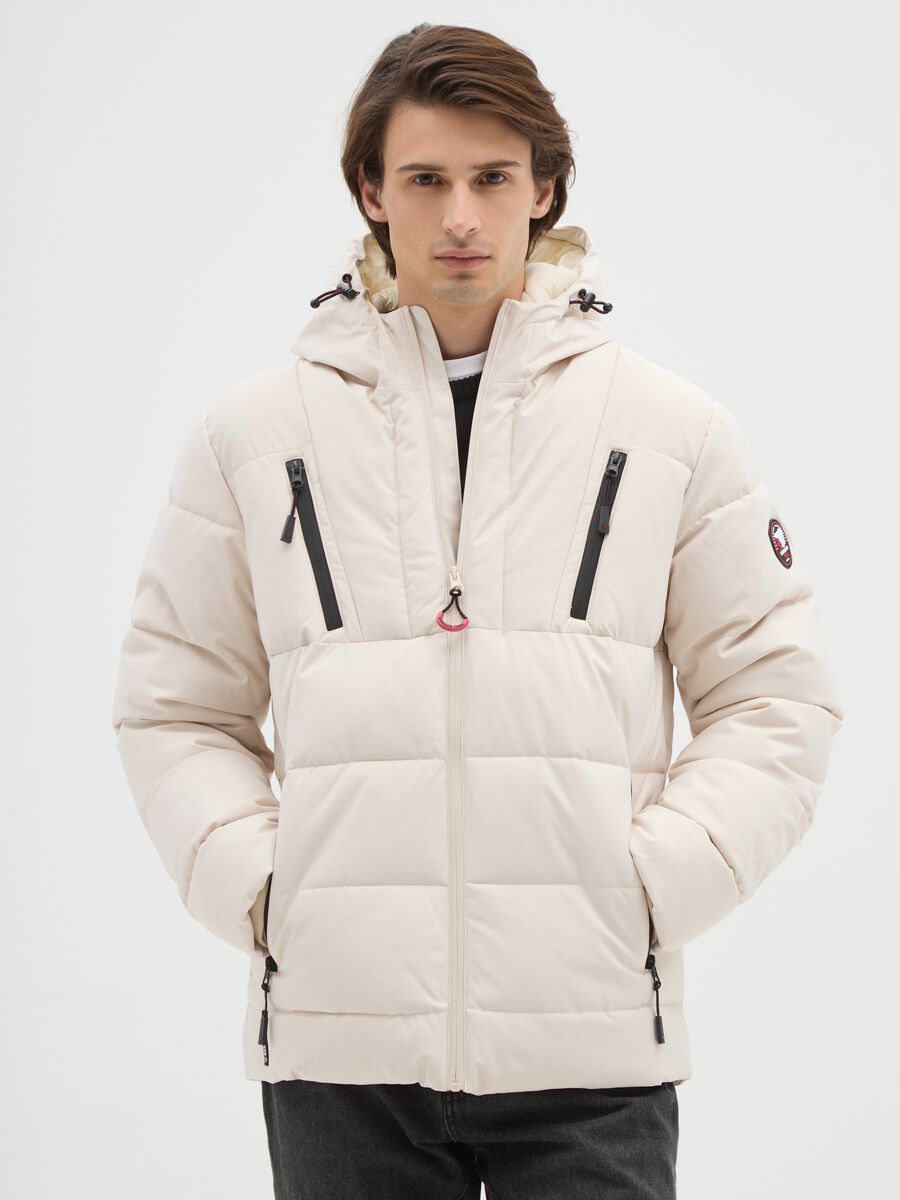 Giacca imbottita beige con cappuccio e zip_0