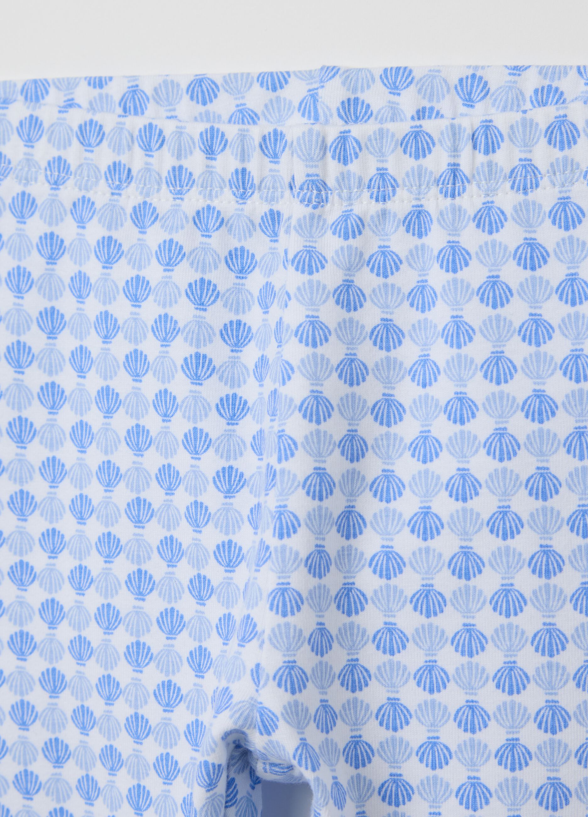 White and light blue three-quarter stretch leggings with print