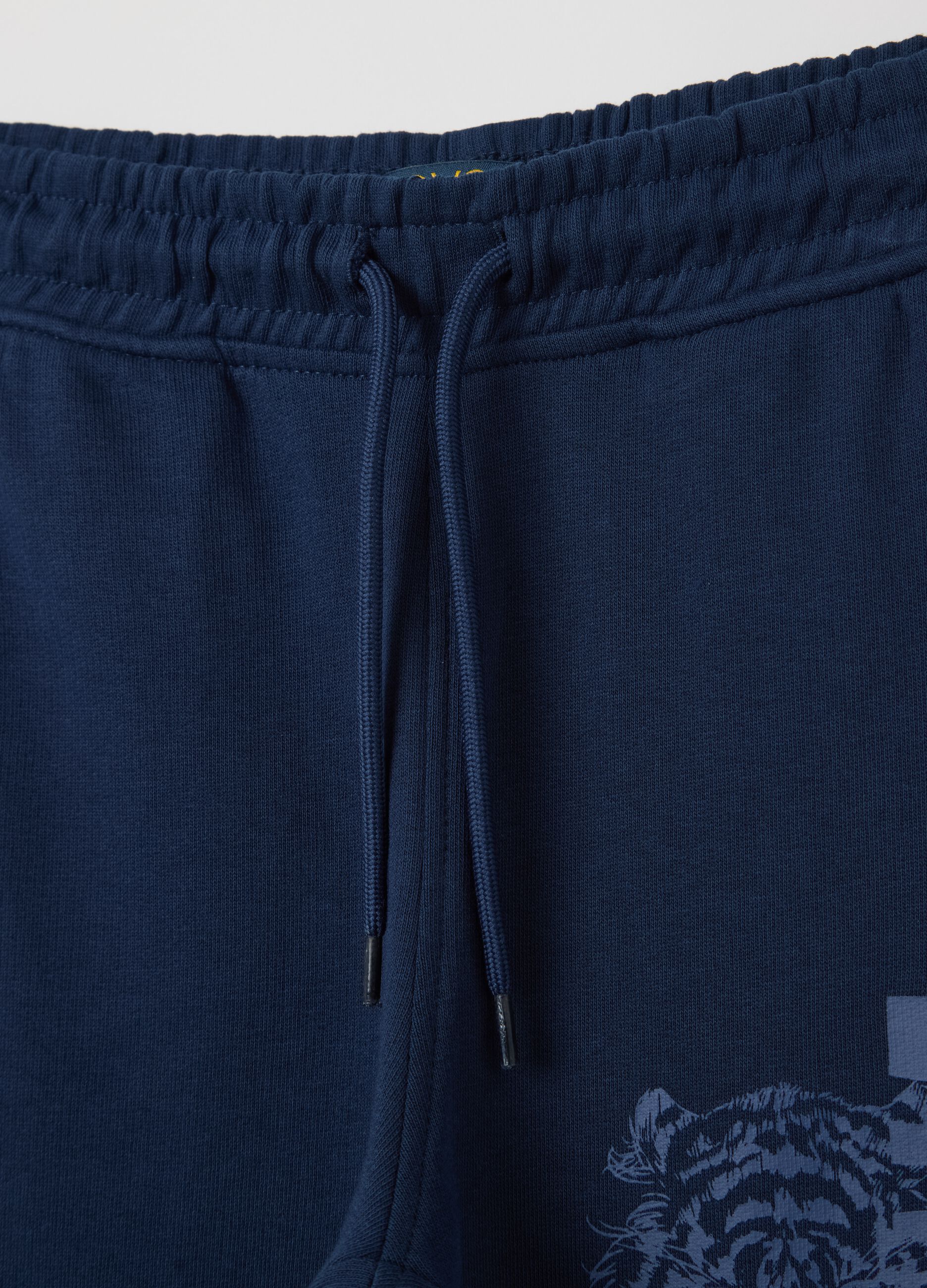 Blue cotton joggers with drawstring and print