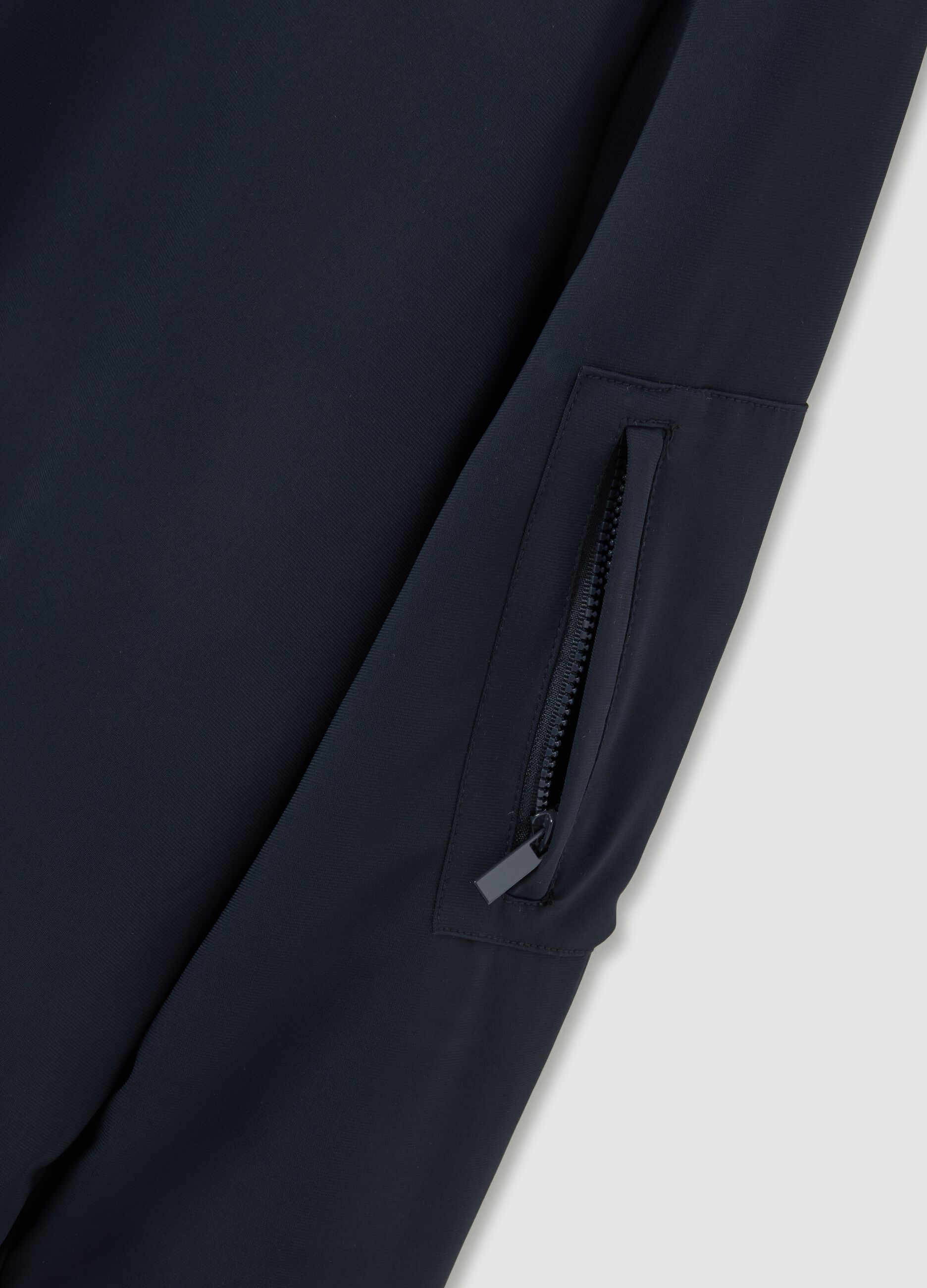 Stretch blue bomber with zip closure
