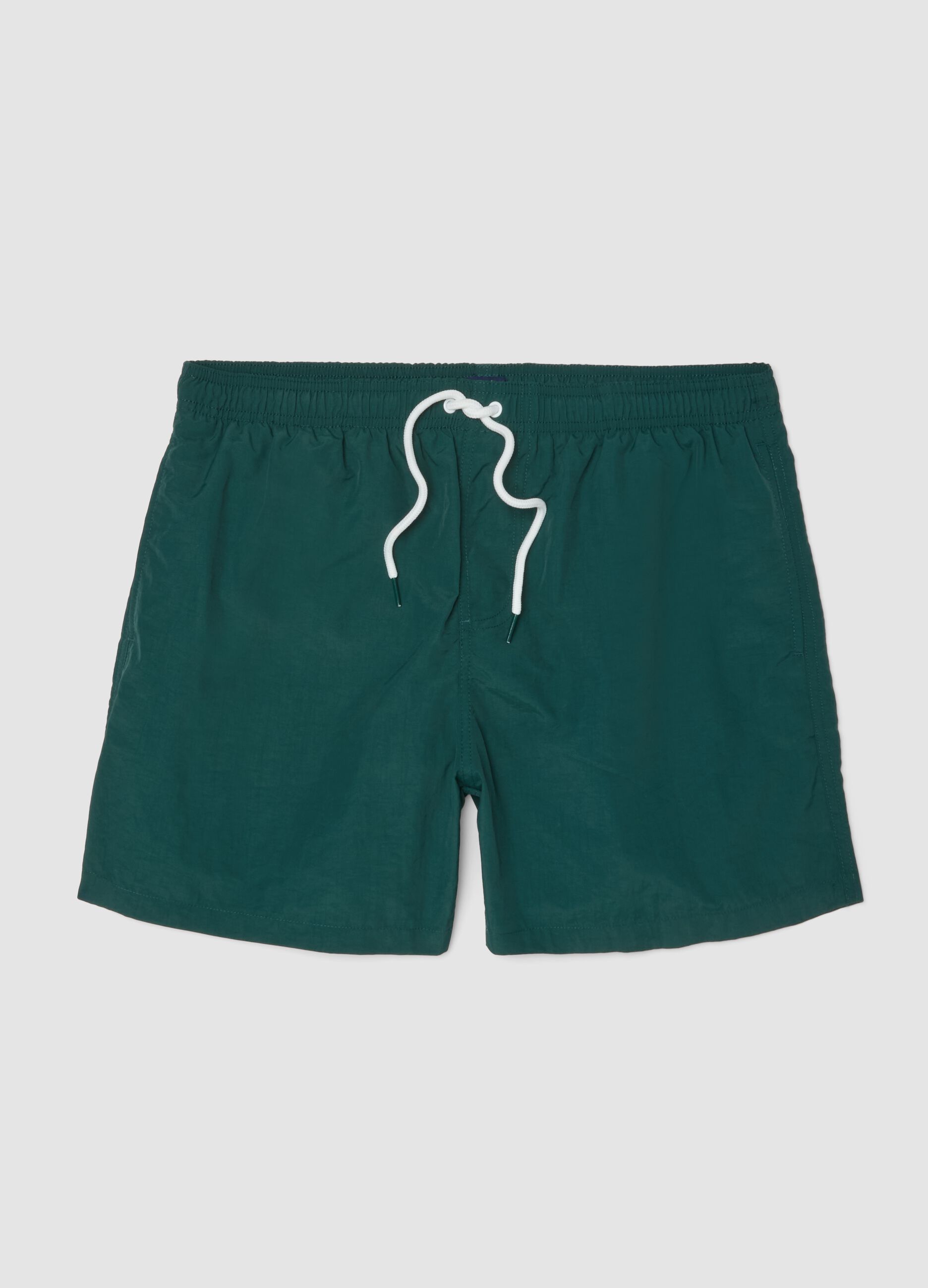 Green swim shorts with elasticated waistband