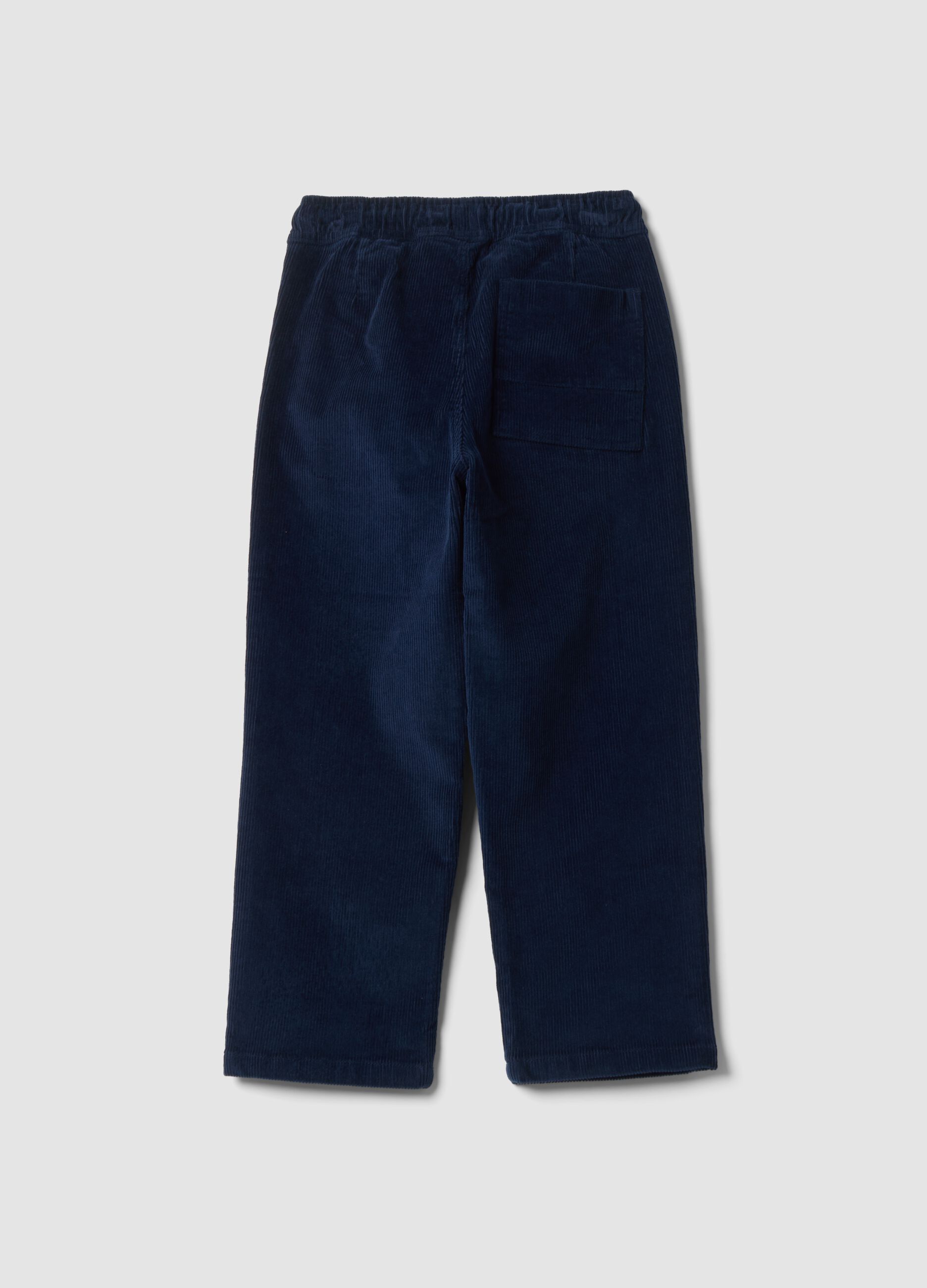Pantaloni blu scuro in cotone elasticizzato a coste