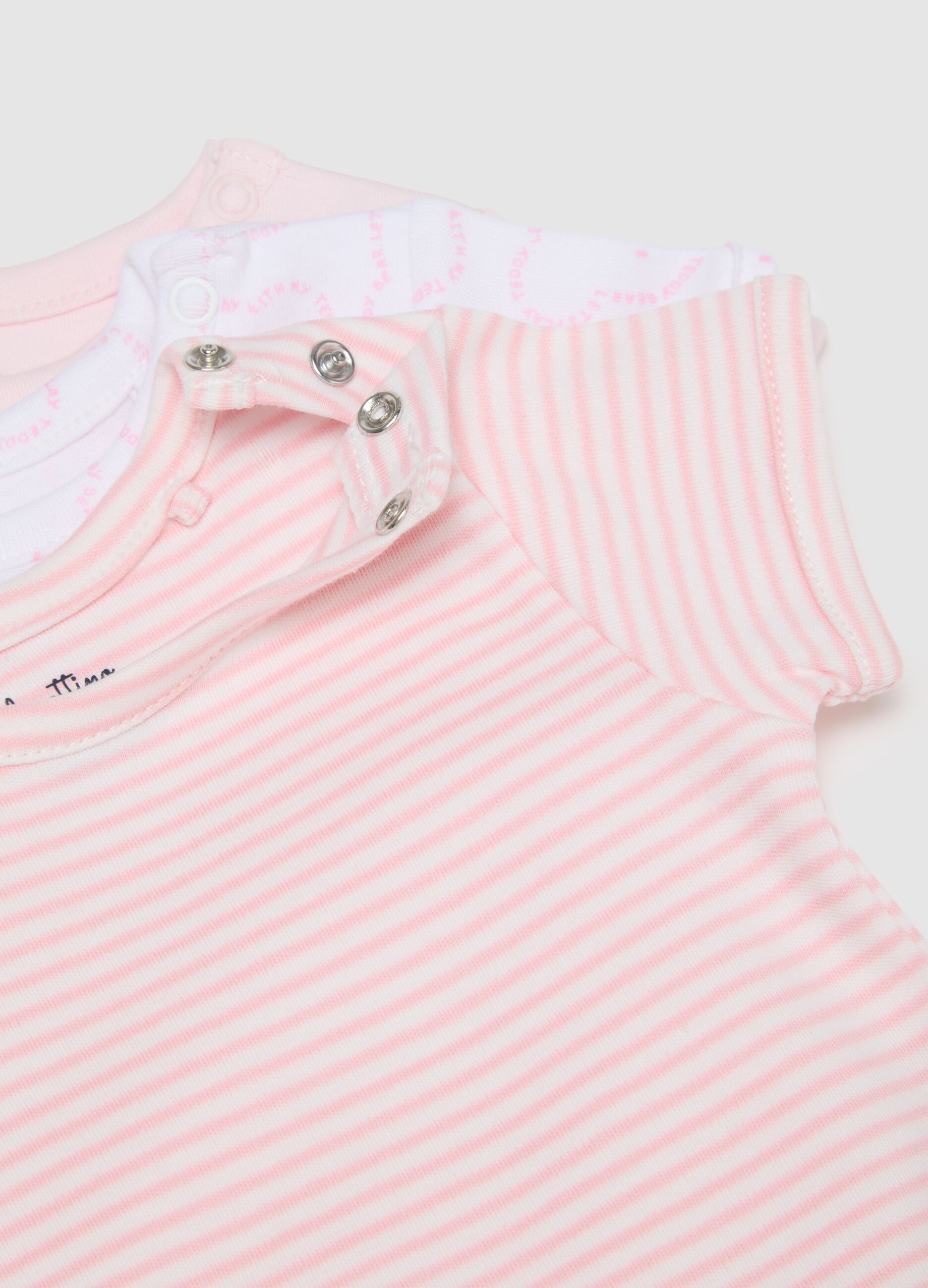 Set of three baby girl cotton bodysuits in multicolour