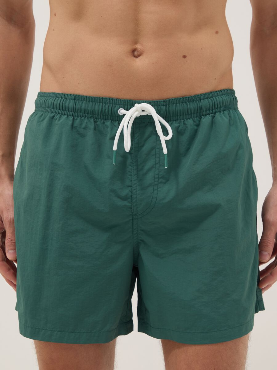 Green swim shorts with elasticated waist_1