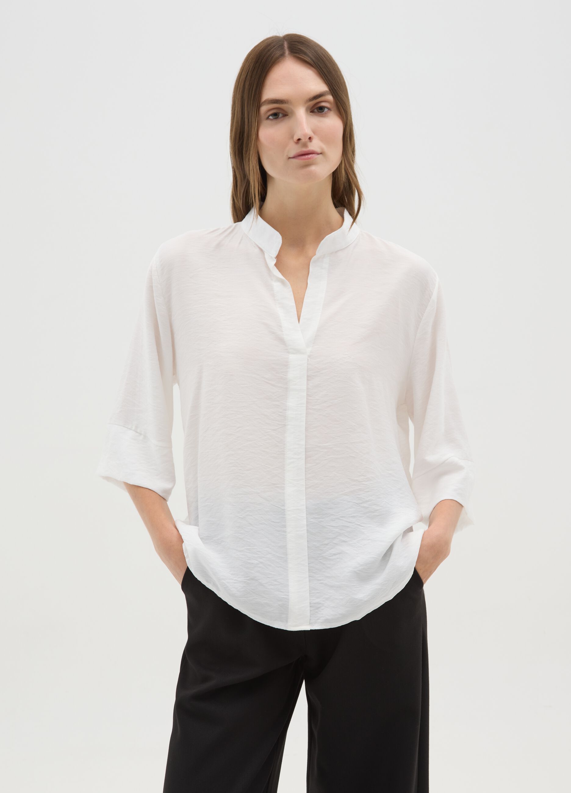 White blouse with V-neck and wide sleeves