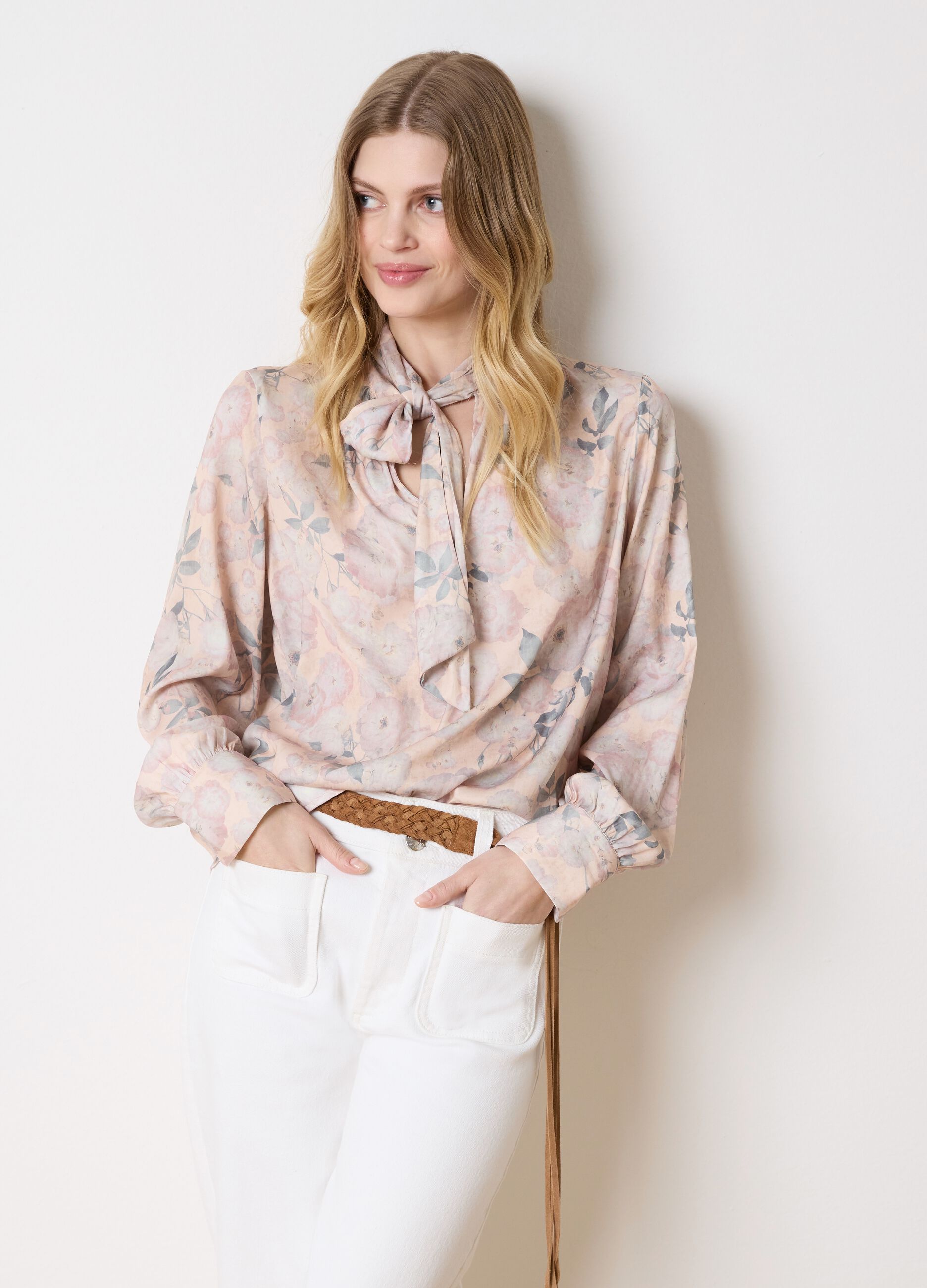 Beige blouse with floral pattern and bow