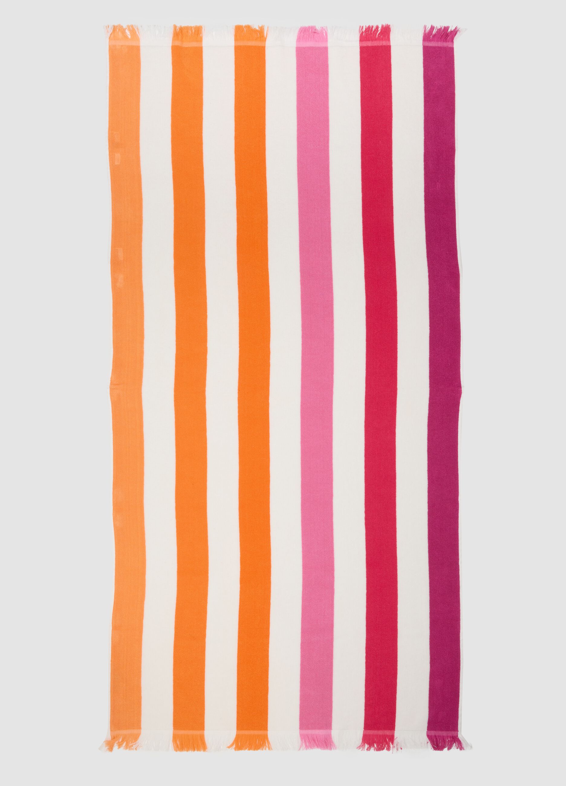 Telo mare multicolor in puro cotone a righe e con frange