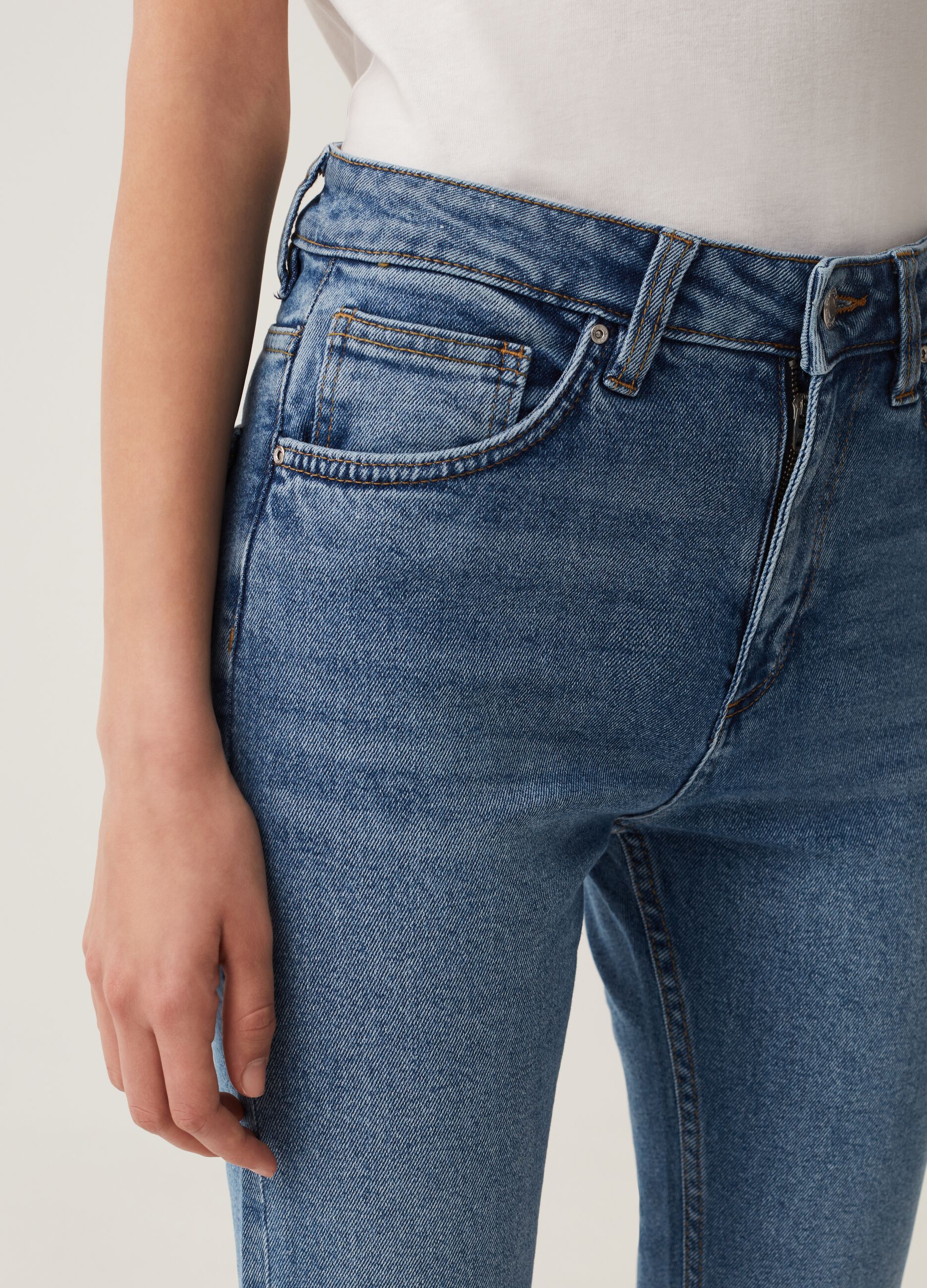 Flare-fit jeans with raw edging