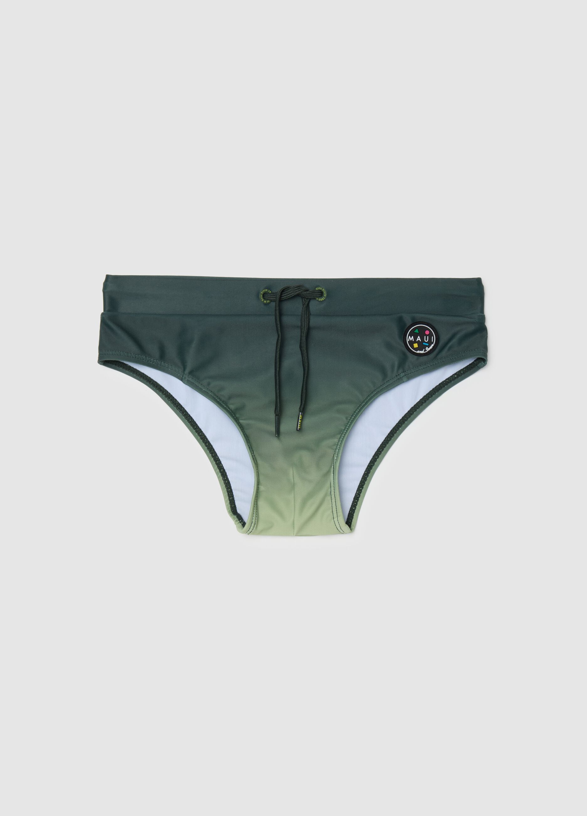 Slip da ragazzo in tessuto elasticizzato verde con logo