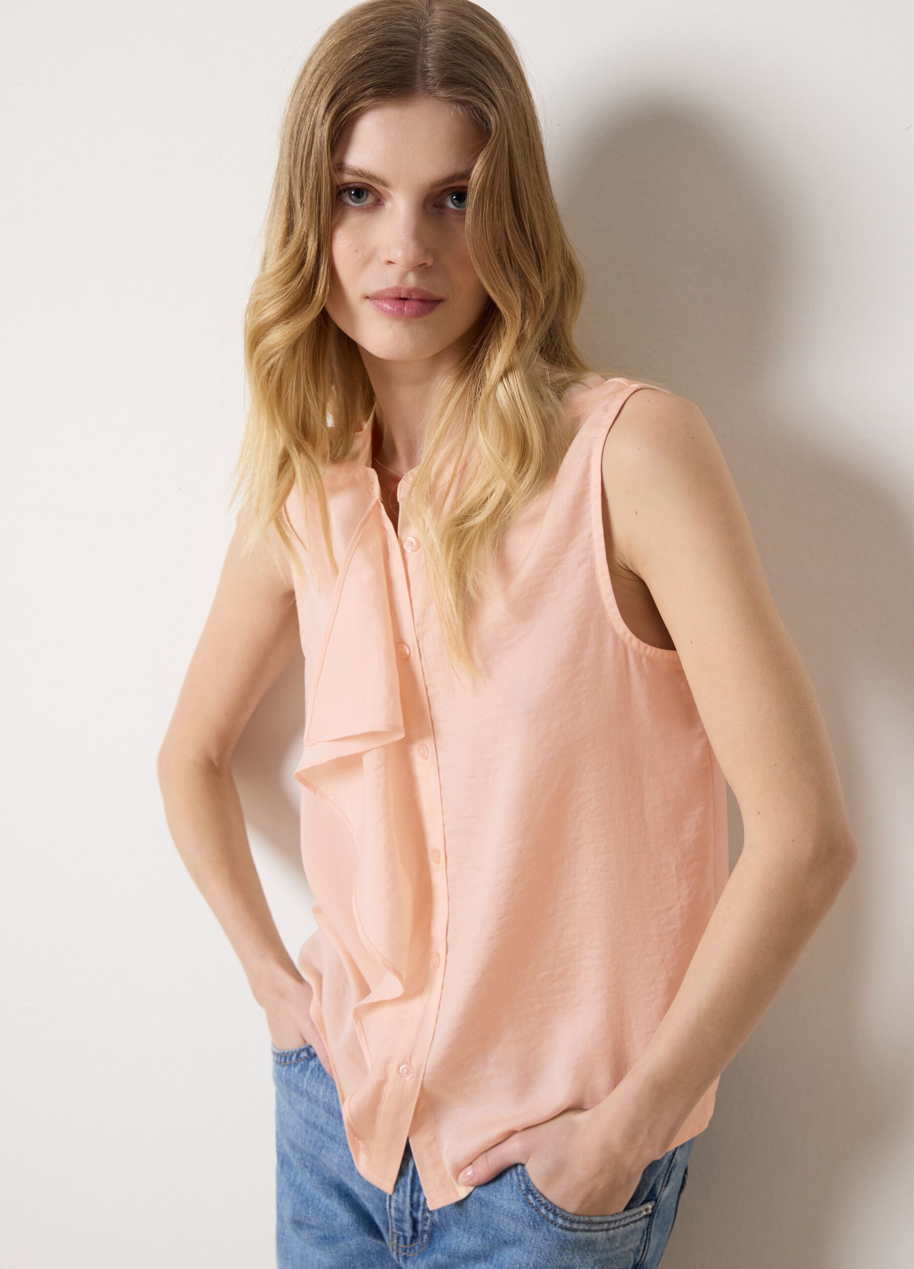 Pink sleeveless blouse with flounce