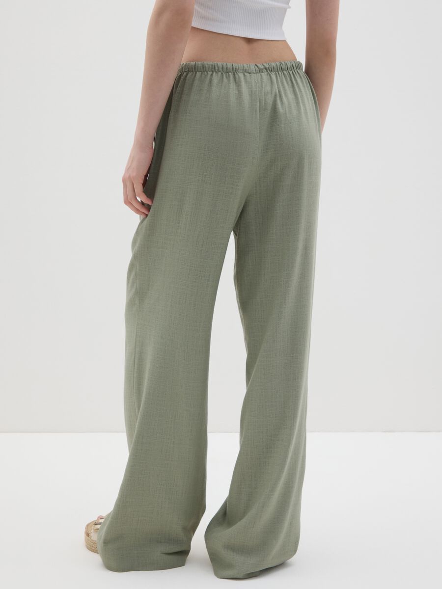 Green wide trousers made of viscose and linen_3