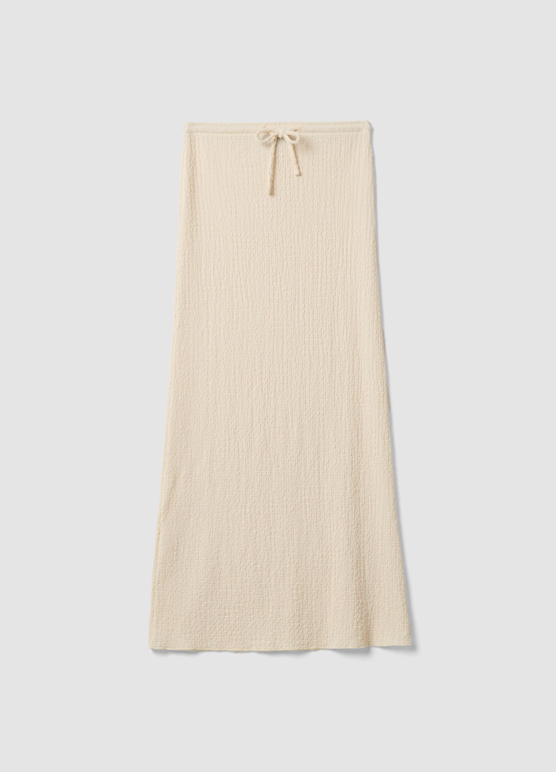 Beige long skirt in stretchy textured fabric