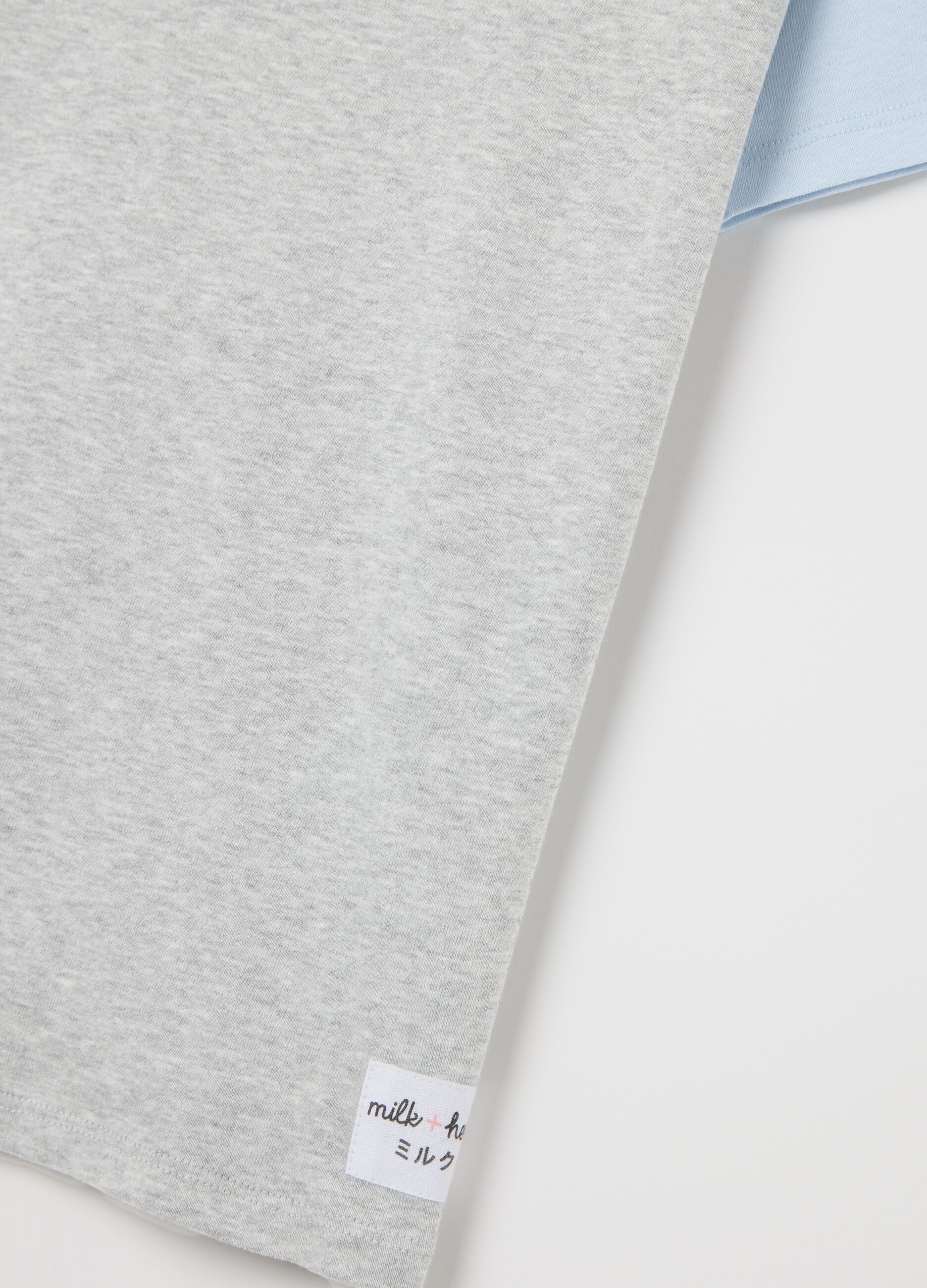 Grey T-shirt with light blue raglan sleeves