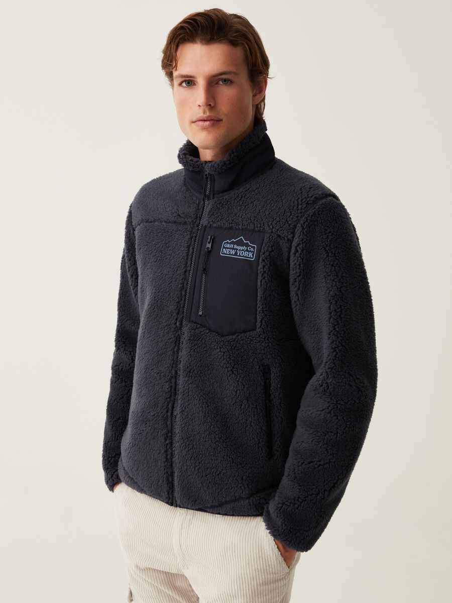 Full-zip in sherpa con tasche_1