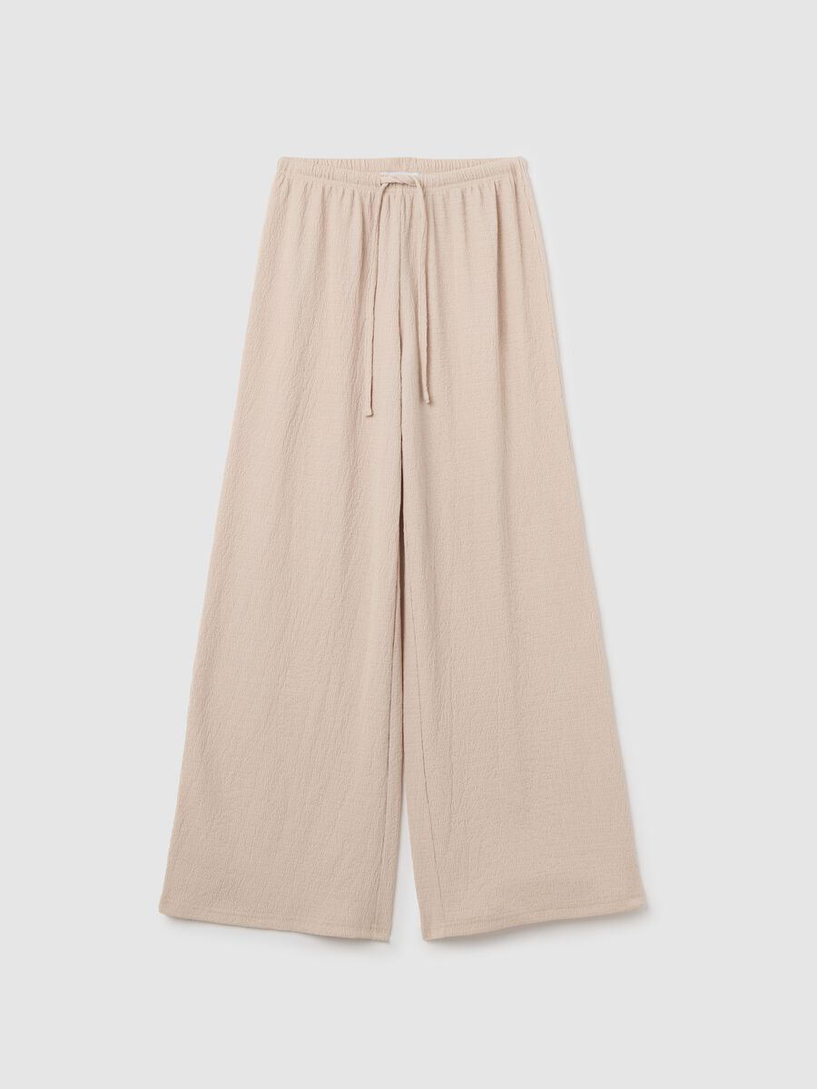 Women's beige regular-fit palazzo pants in stretch fabric._4