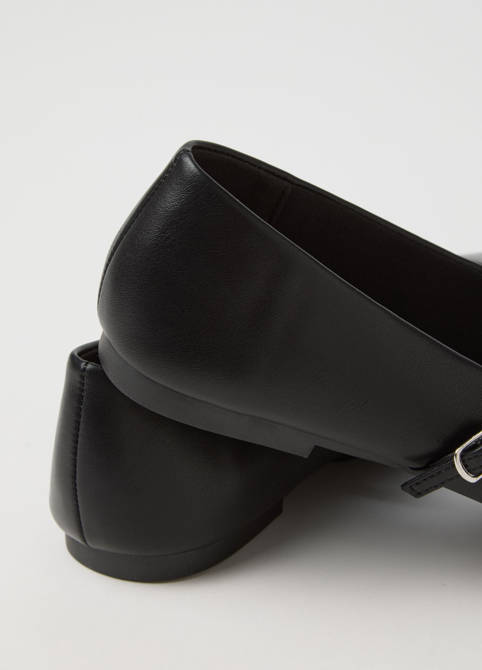 Black ballet flats with strap