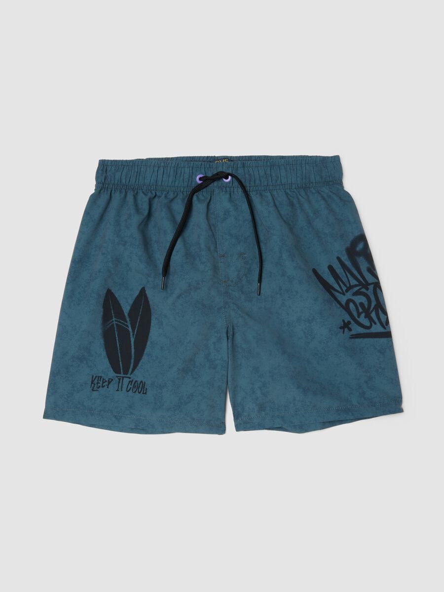 Blue swim shorts with print_0