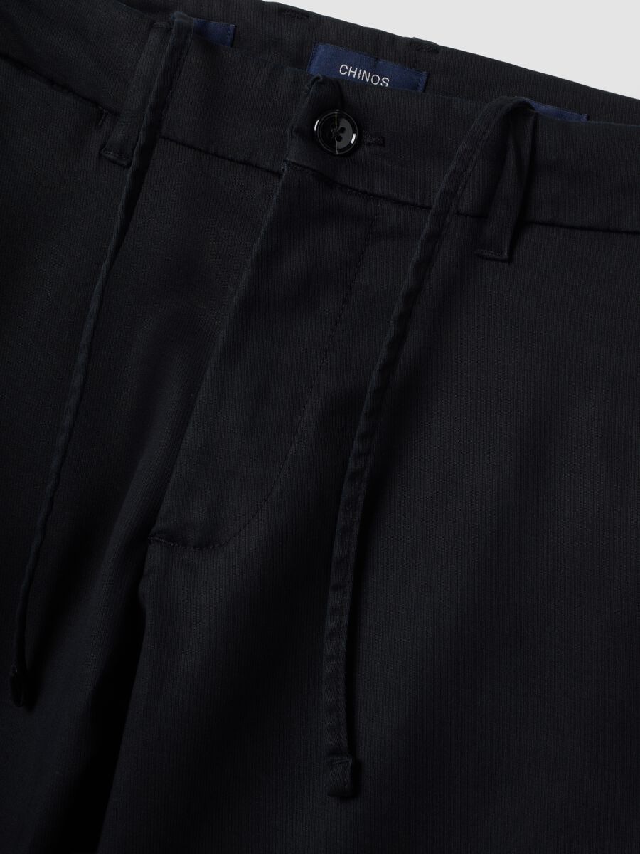Black slim-fit stretch cotton and lyocell chino trousers_1