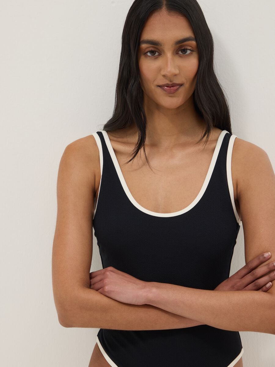 Black stretch one-piece swimsuit with white trim_3