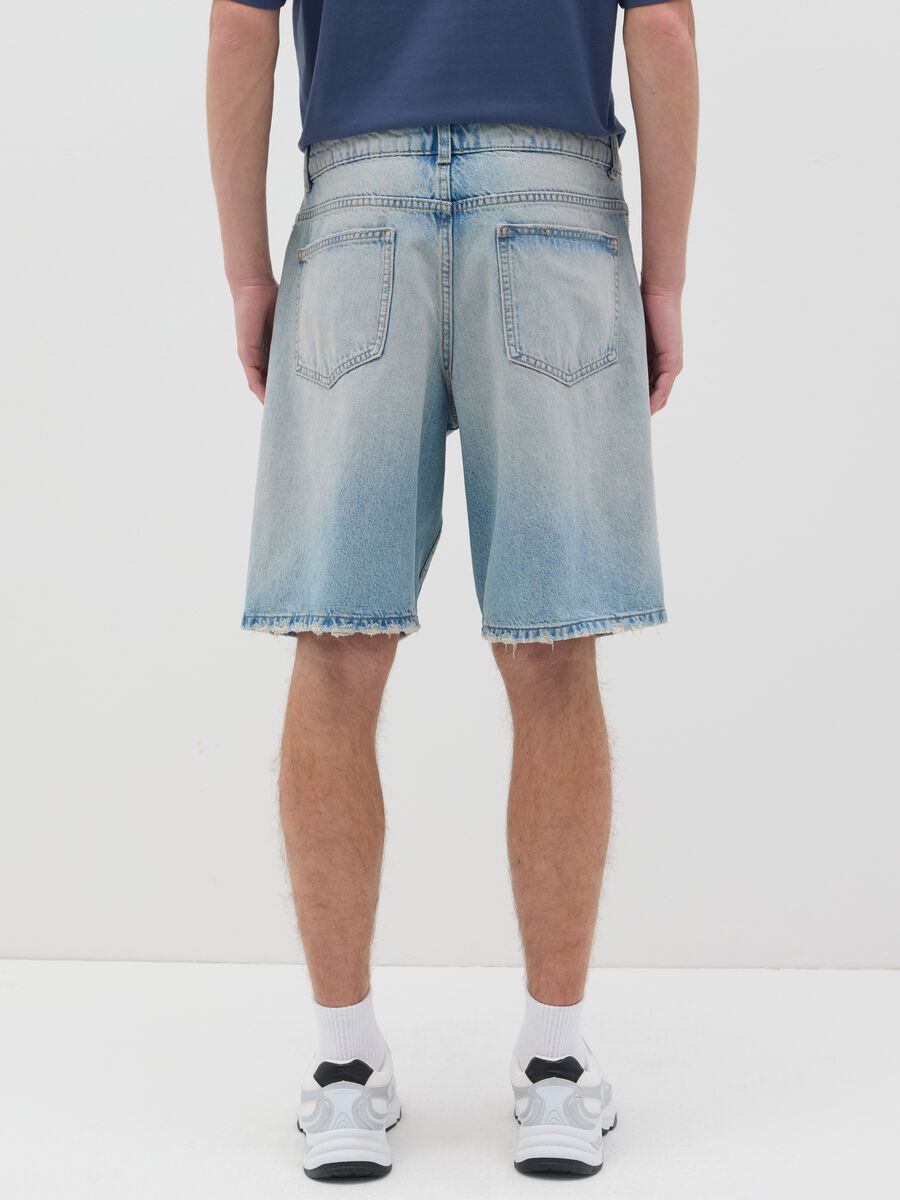Blue denim shorts with ripped details_2