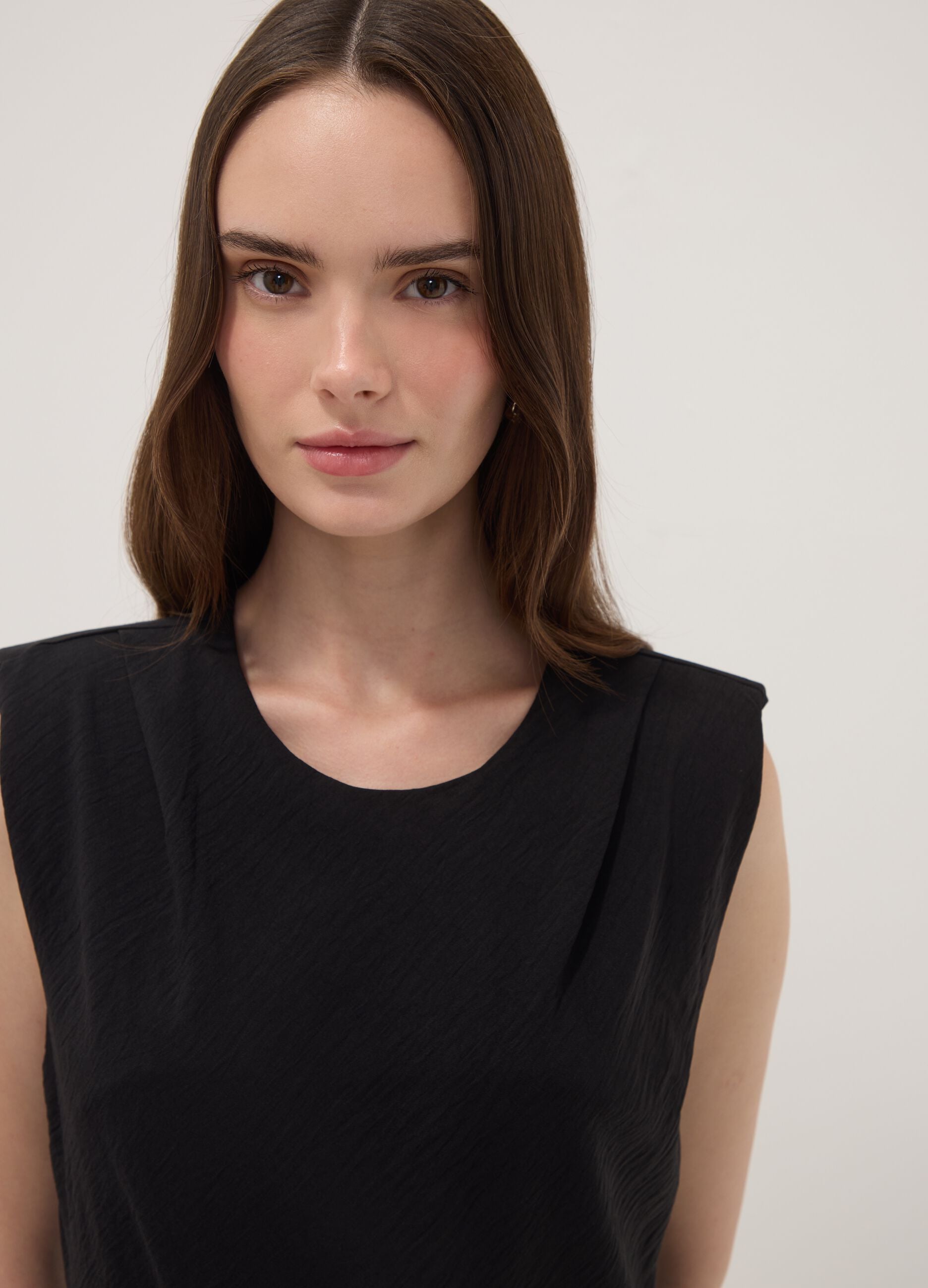 Black fitted dress with ruched detailing