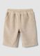 Pantaloni beige in tessuto elasticizzato a coste per neonata_0