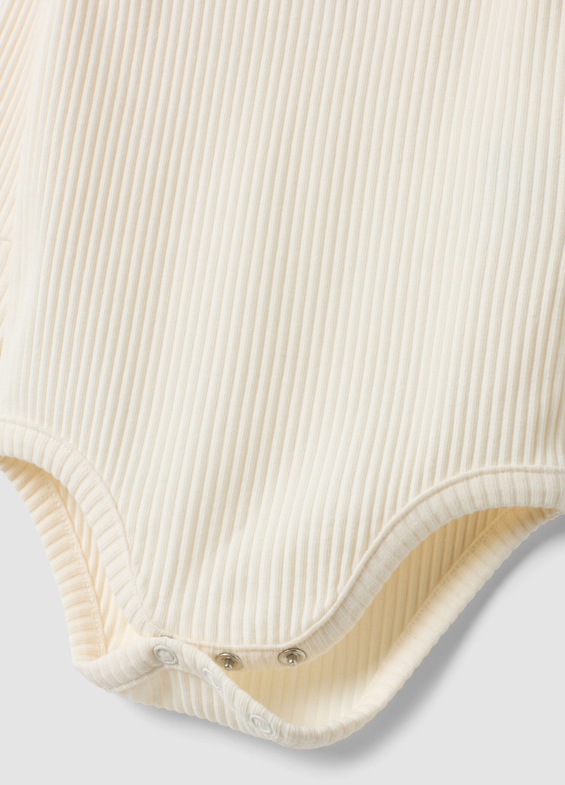 White ribbed organic cotton Disney bodysuit with ruffles and 101 Dalmatians print for baby girl