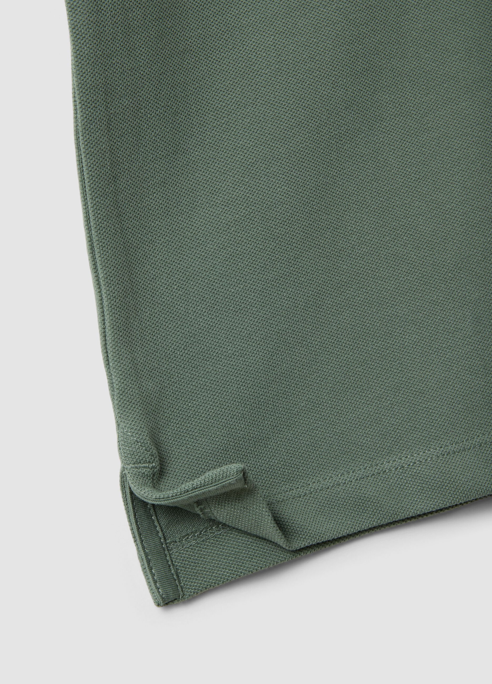 Green short-sleeved polo shirt in pure organic cotton
