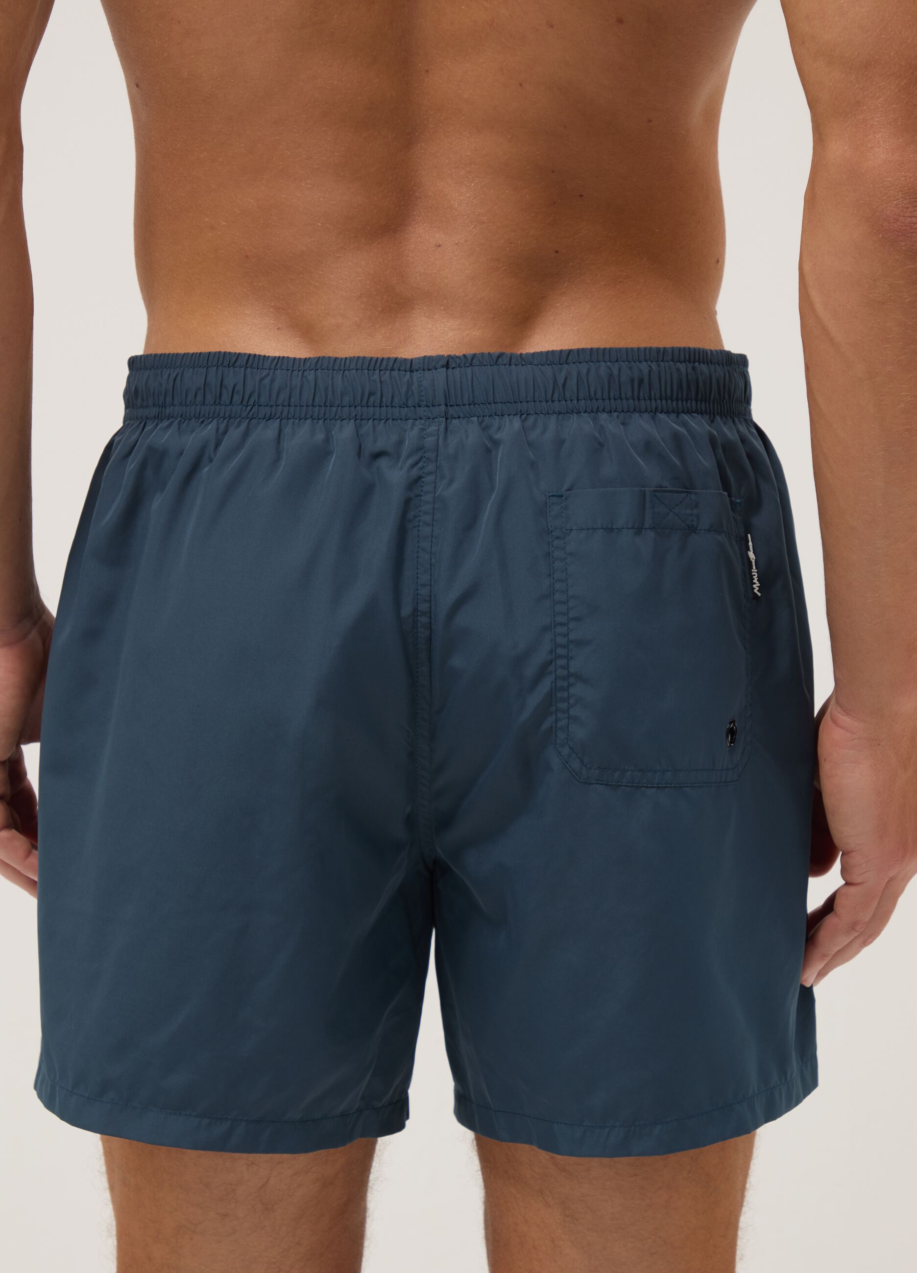 Blue swim shorts with elasticated waistband and drawstring