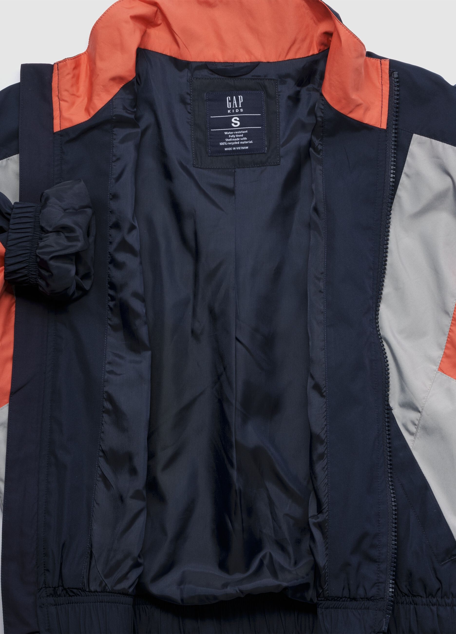 Light blue jacket with orange and grey accents