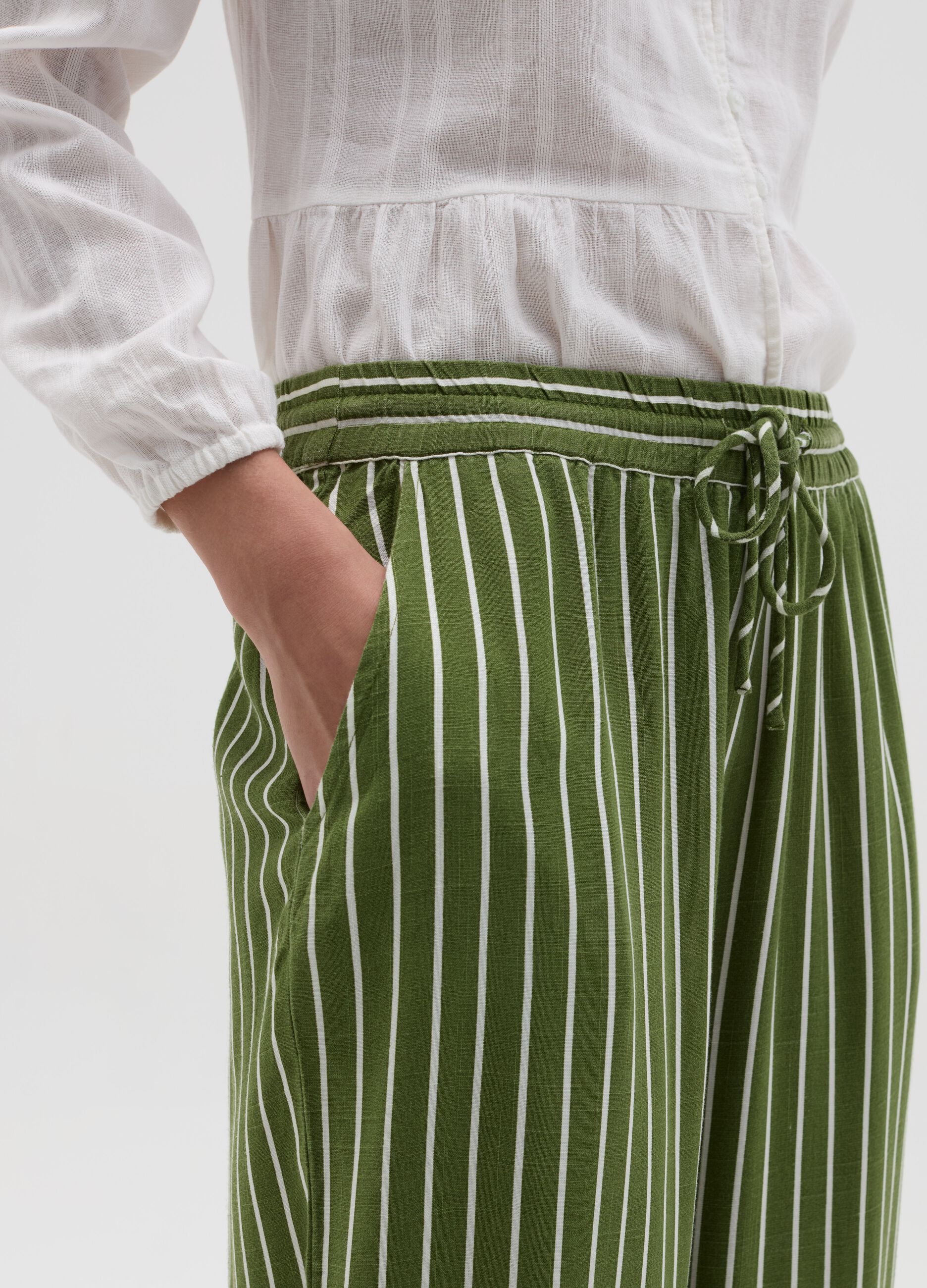 Striped green palazzo trousers in viscose and linen