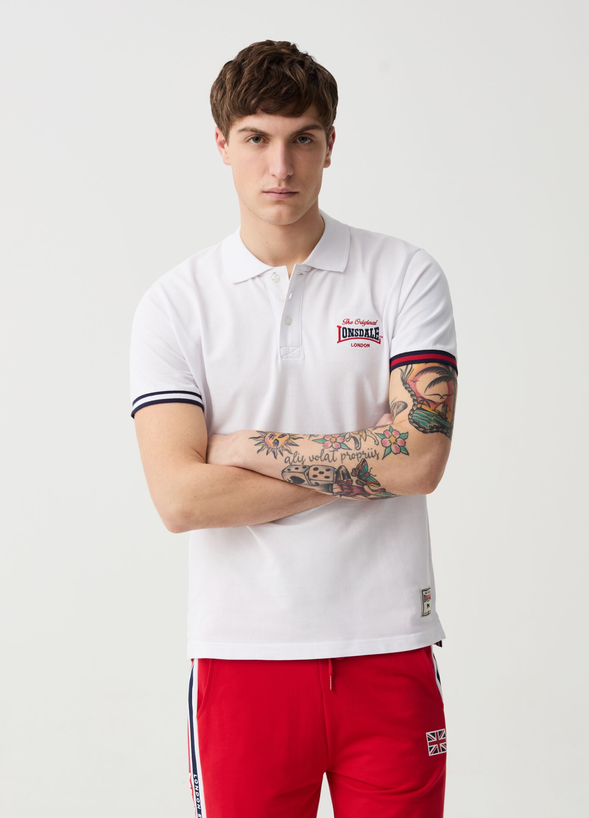 Polo shirt with striped edging and logo embroidery