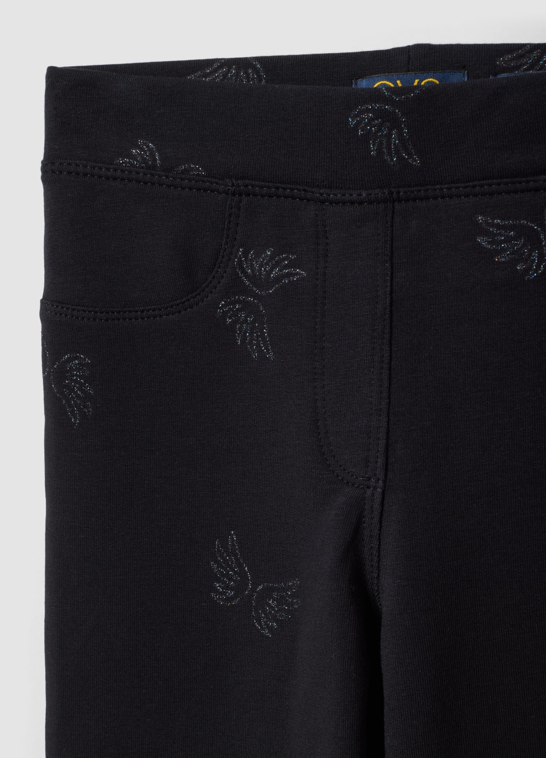 Treggings flare neri in cotone organico elasticizzato con ali glitterate