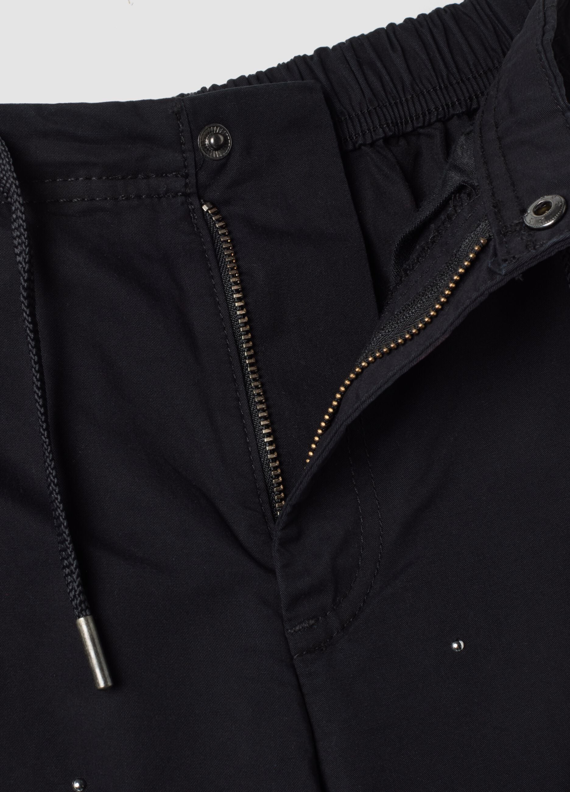 Blue parachute-fit trousers in pure cotton