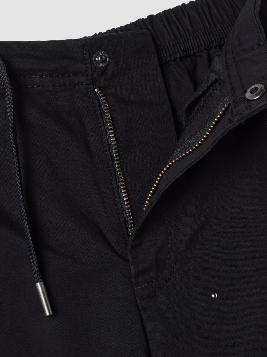 Blue parachute-fit trousers in pure cotton_1