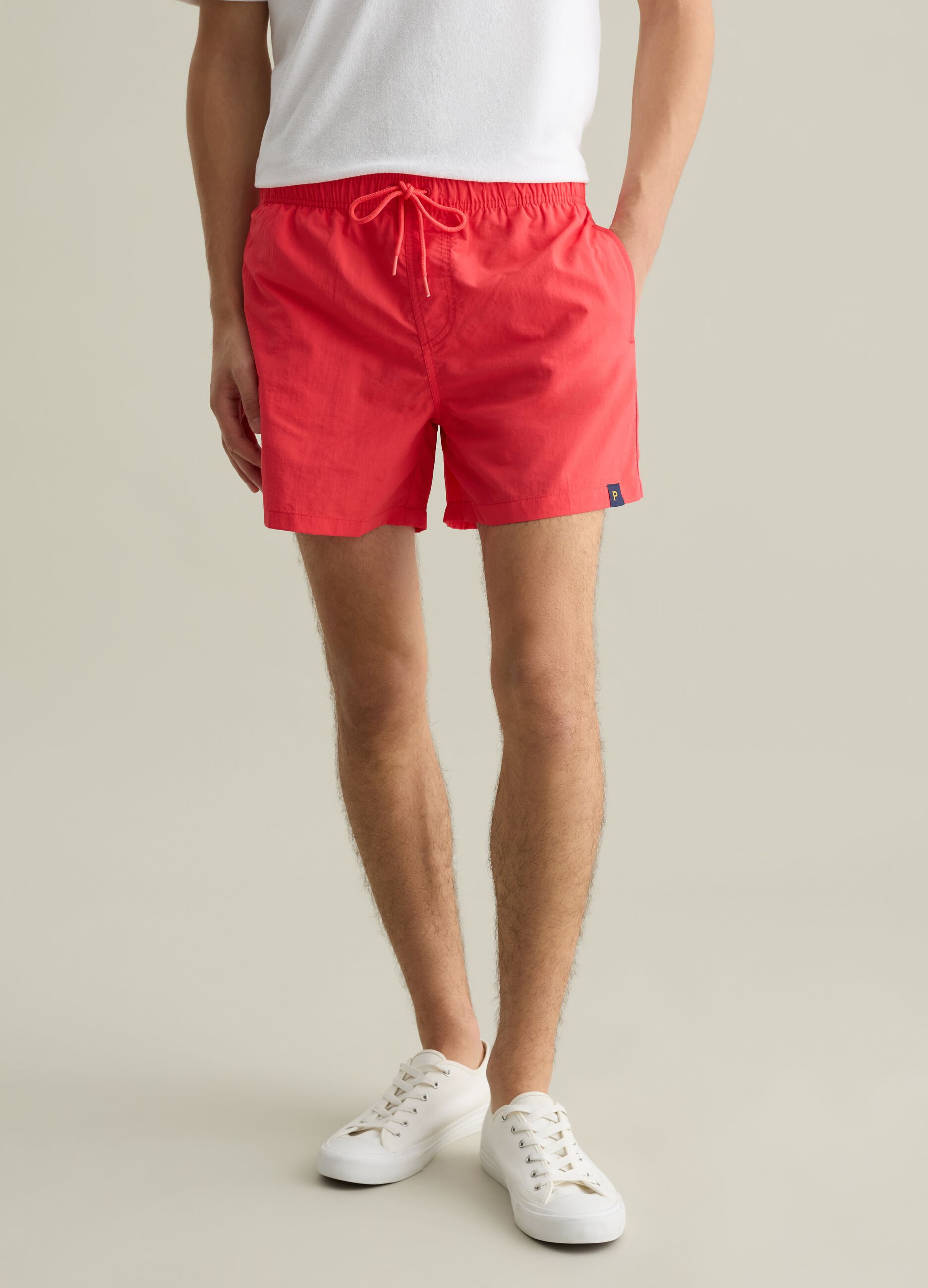 Men’s regular-fit swim boxers in red blend with elastic waist