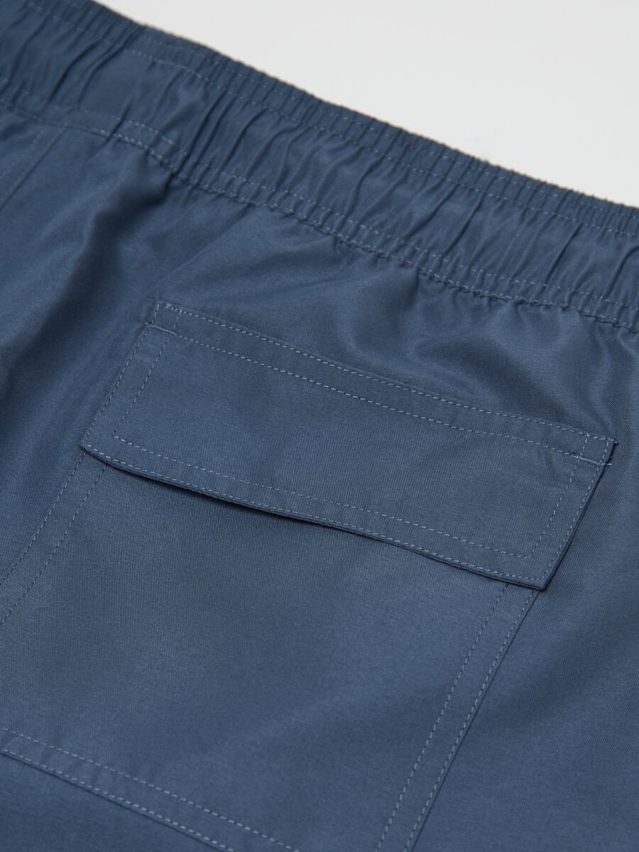 Blue swimming trunks with logo print_5