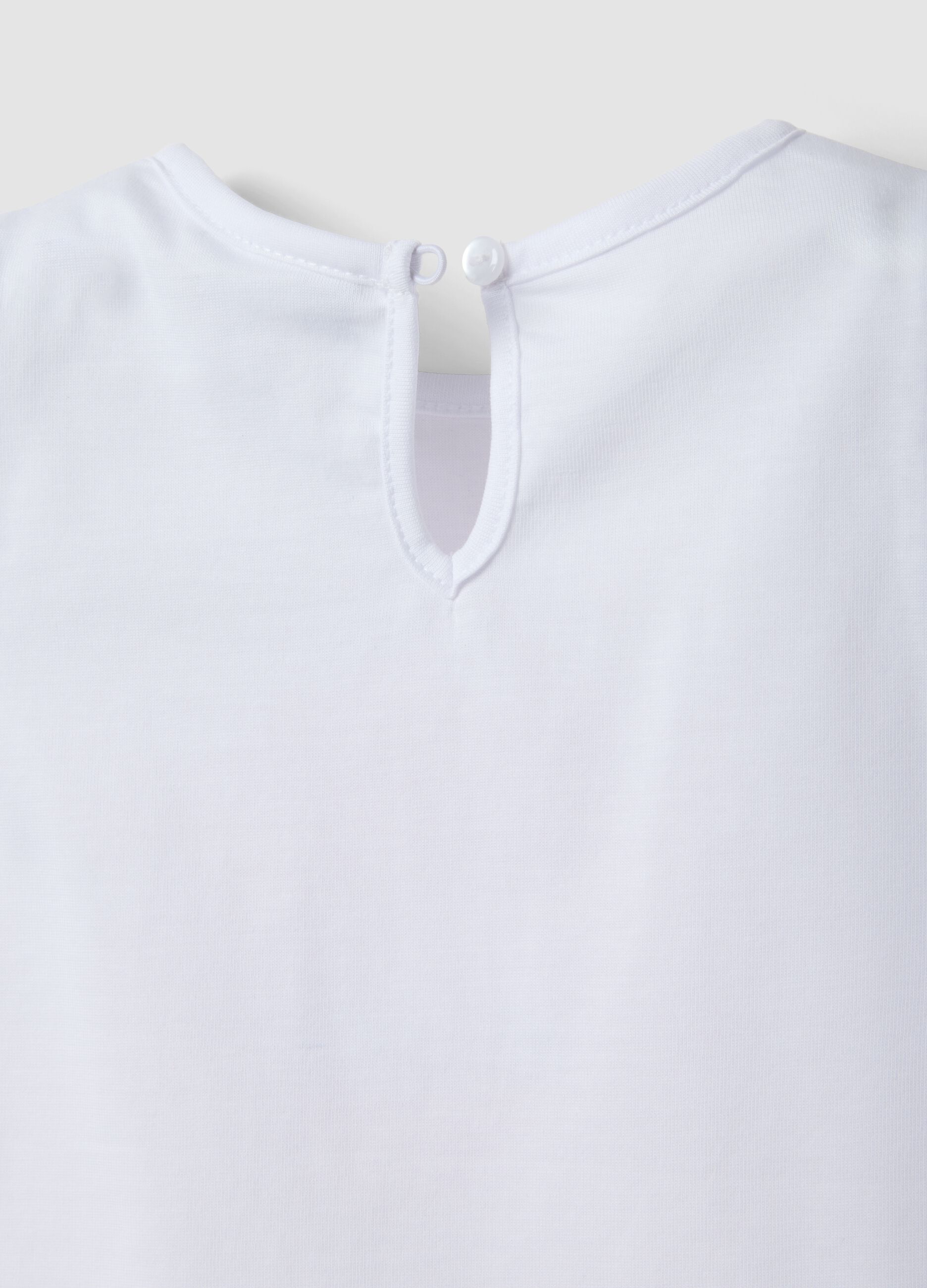 White organic cotton girls&rsquo; tank top with print and ruffles