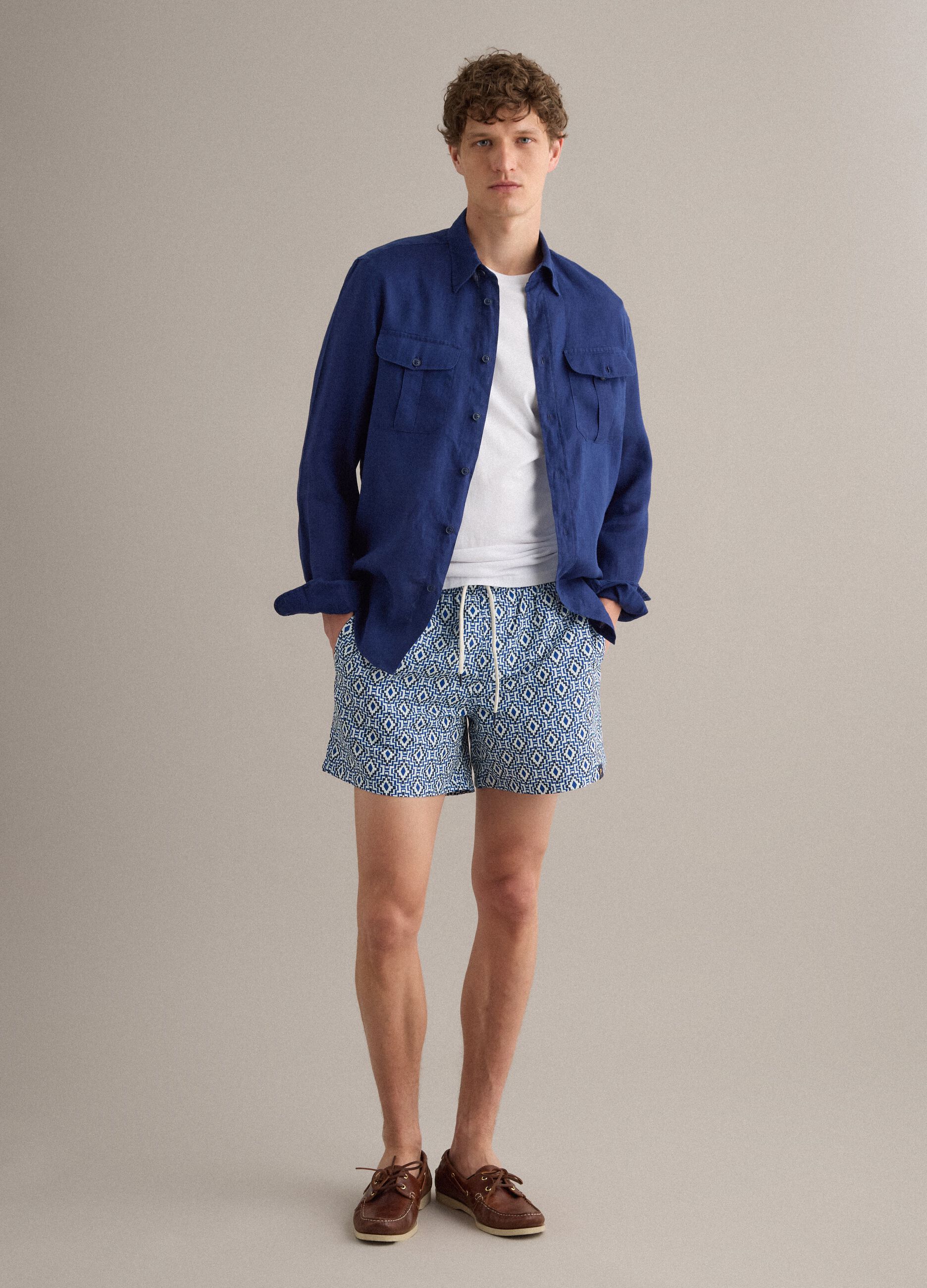 Blue swim shorts with geometric print
